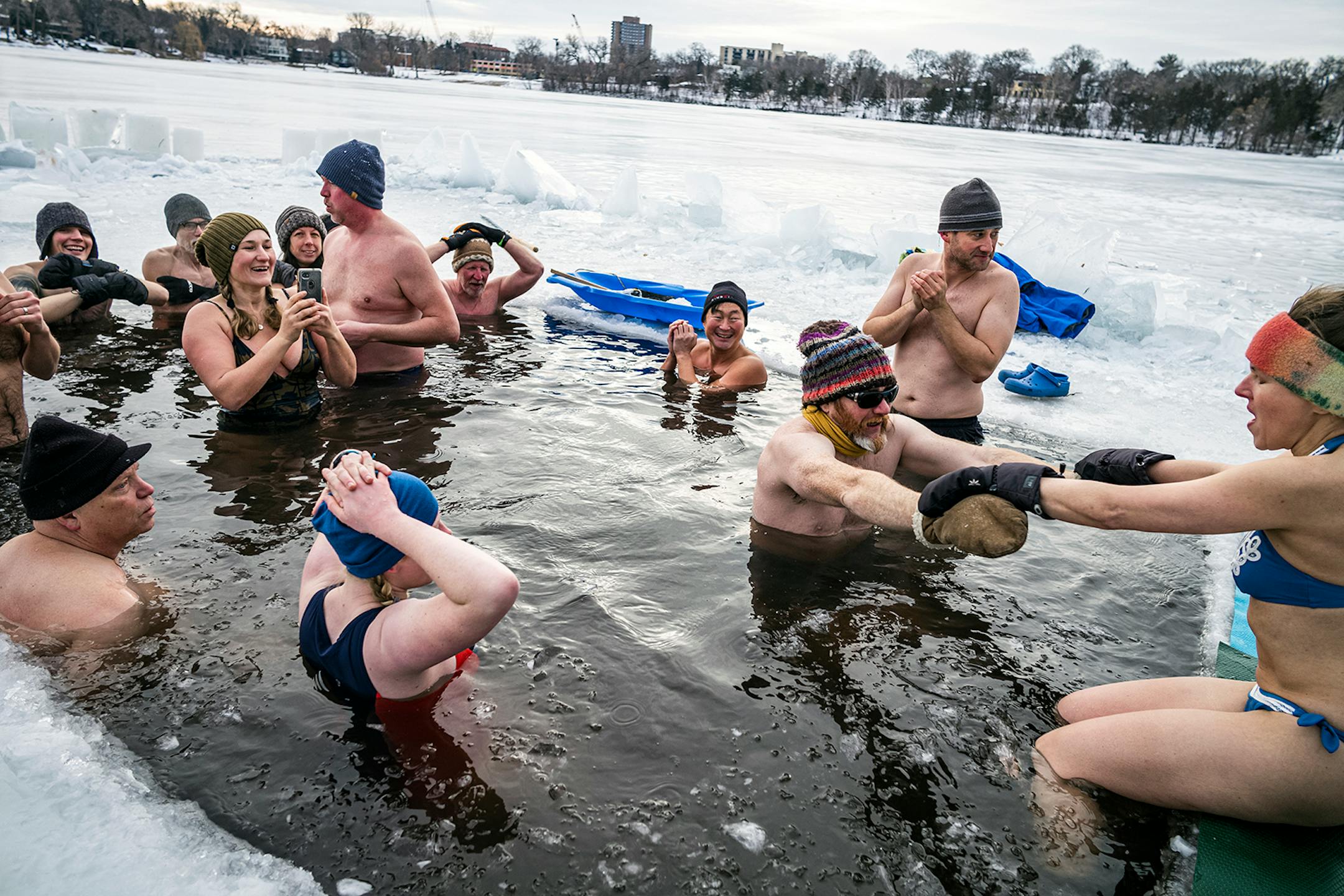More than a dozen people can fit in the hole opened up by maestro Svetlana Vold, holding phone in Cedar Lake.