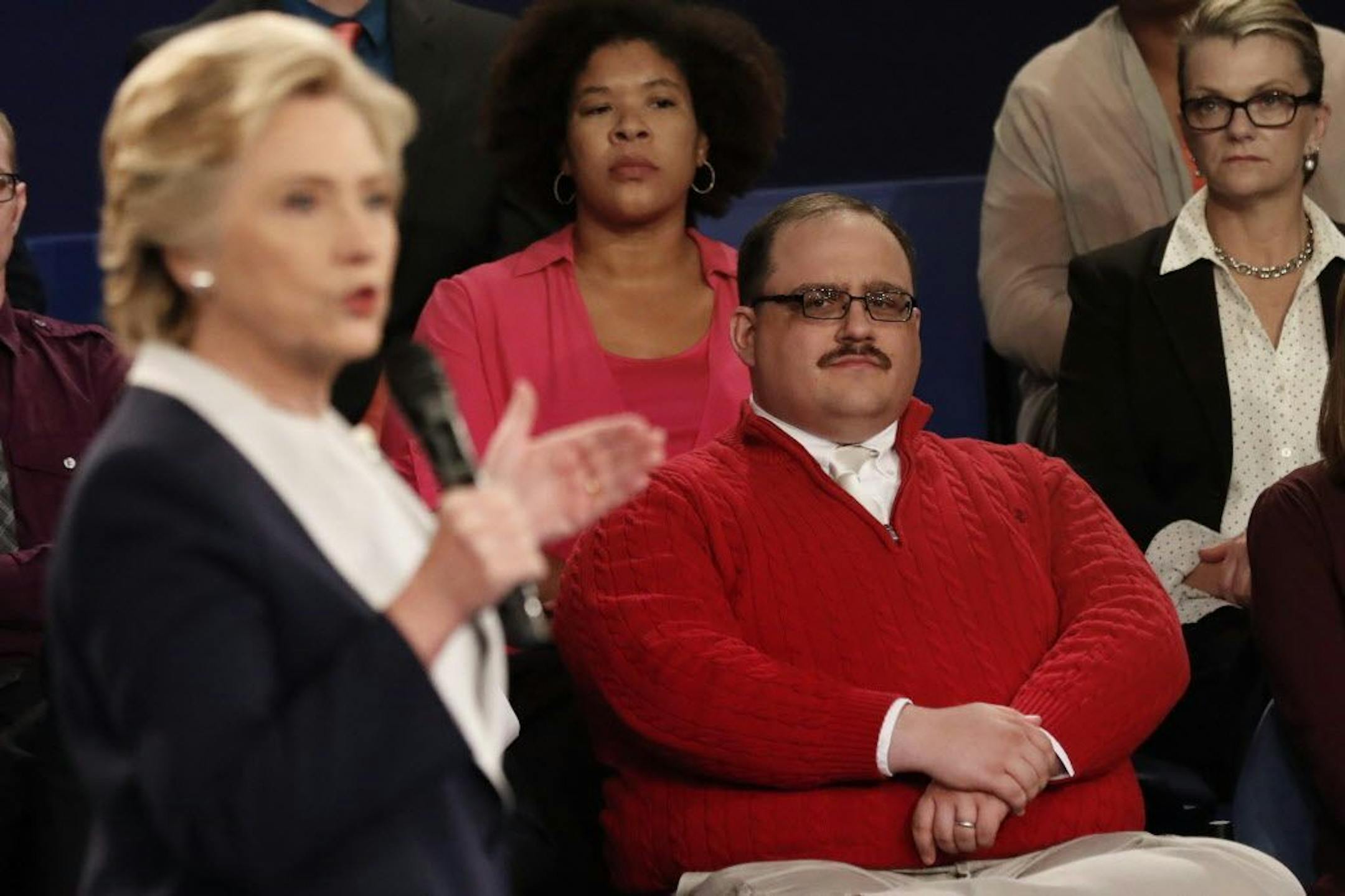 Kenneth Bone listens as Democratic presidential nominee Hillary Clinton answers a question during the second presidential debate with Republican presidential nominee Donald Trump at Washington University in St. Louis, Sunday, Oct. 9, 2016.