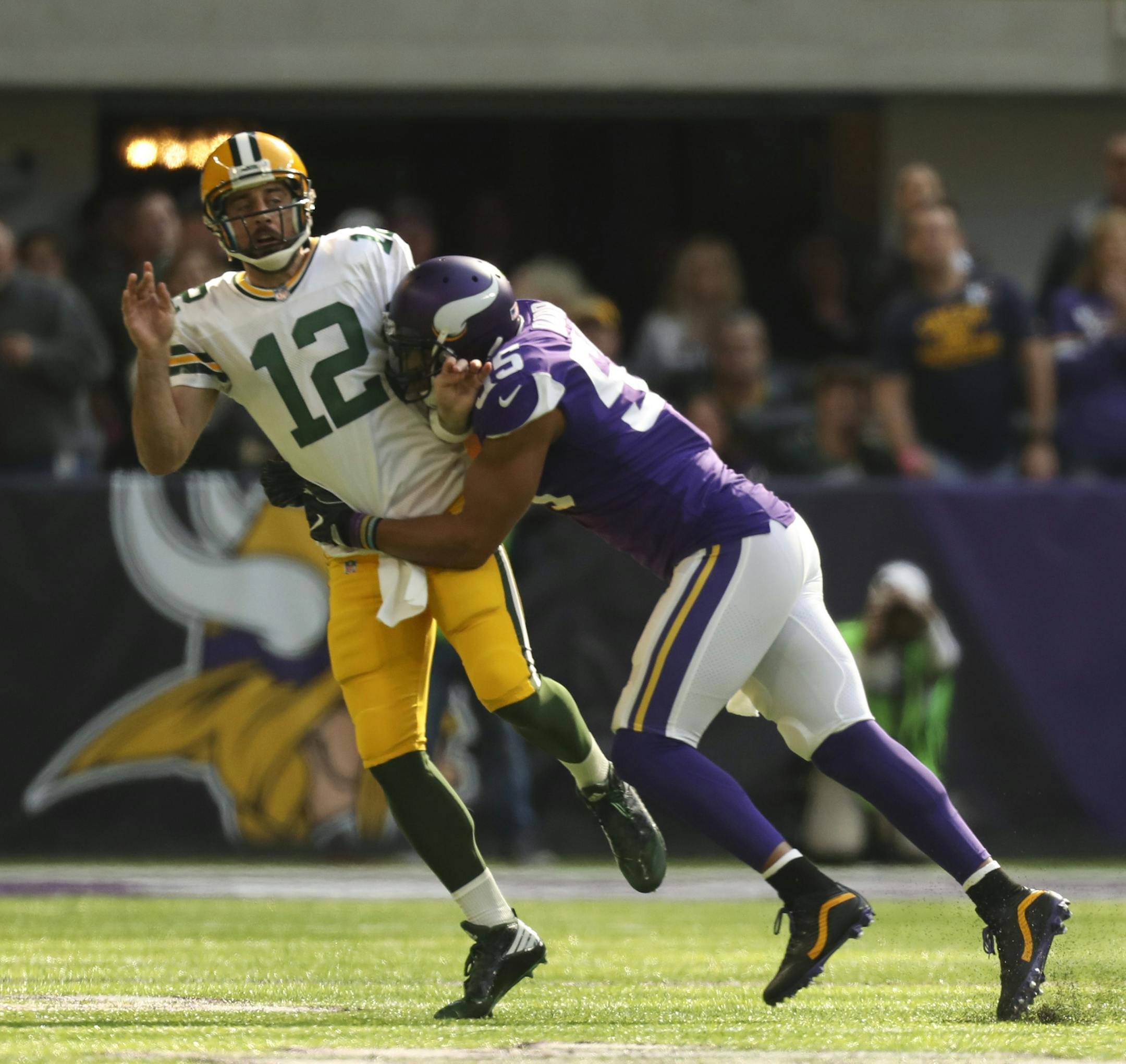 Green Bay Packers quarterback Aaron Rodgers (12) left the game after a hit on this play by Minnesota Vikings outside linebacker Anthony Barr (55) in the first quarter. ] JEFF WHEELER ï jeff.wheeler@startribune.com The Minnesota Vikings met the Green Bay Packers in an NFL football game Sunday afternoon, October 15, 2017 at U.S. Bank Stadium in Minneapolis.