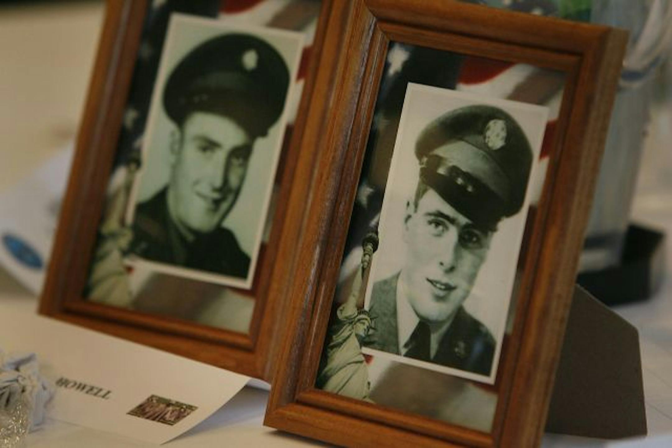 Photographs of brothers Joseph, left, and Dale Howell sat on a table Saturday at the Minneapolis Marriott Southwest. Joseph Howell was reported missing in action in the Korean War. Dale joined the Army to search for him and was subsequently killed.