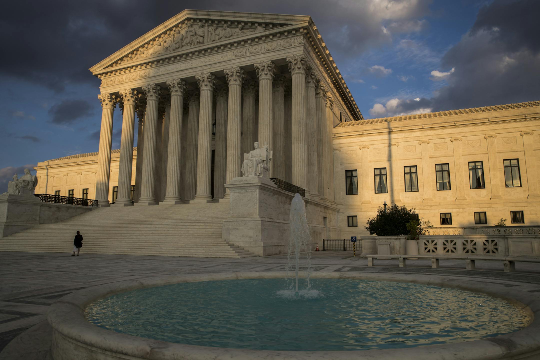 In this Oct. 10, 2017 photo, the Supreme Court in Washington is seen at sunset. The court heard oral arguments Wednesday on a Minnesota case involving the wearing of political insignia at polling places. (AP Photo/J. Scott Applewhite)