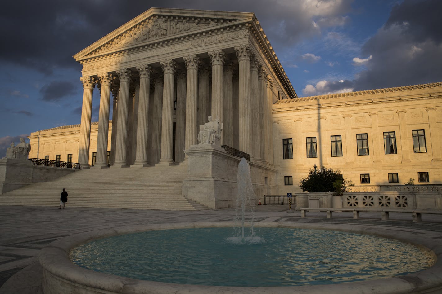 In this Oct. 10, 2017 photo, the Supreme Court in Washington is seen at sunset. The court heard oral arguments Wednesday on a Minnesota case involving the wearing of political insignia at polling places. (AP Photo/J. Scott Applewhite)