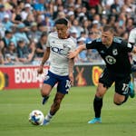 D.C. United midfielder Andy Najar (14) runs down the field while Minnesota United midfielder Robin Lod (17) tries to guard during the first half the m