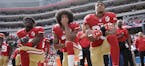 FILE - In this Oct. 2, 2016 file photo, from left, San Francisco 49ers outside linebacker Eli Harold, quarterback Colin Kaepernick and safety Eric Rei
