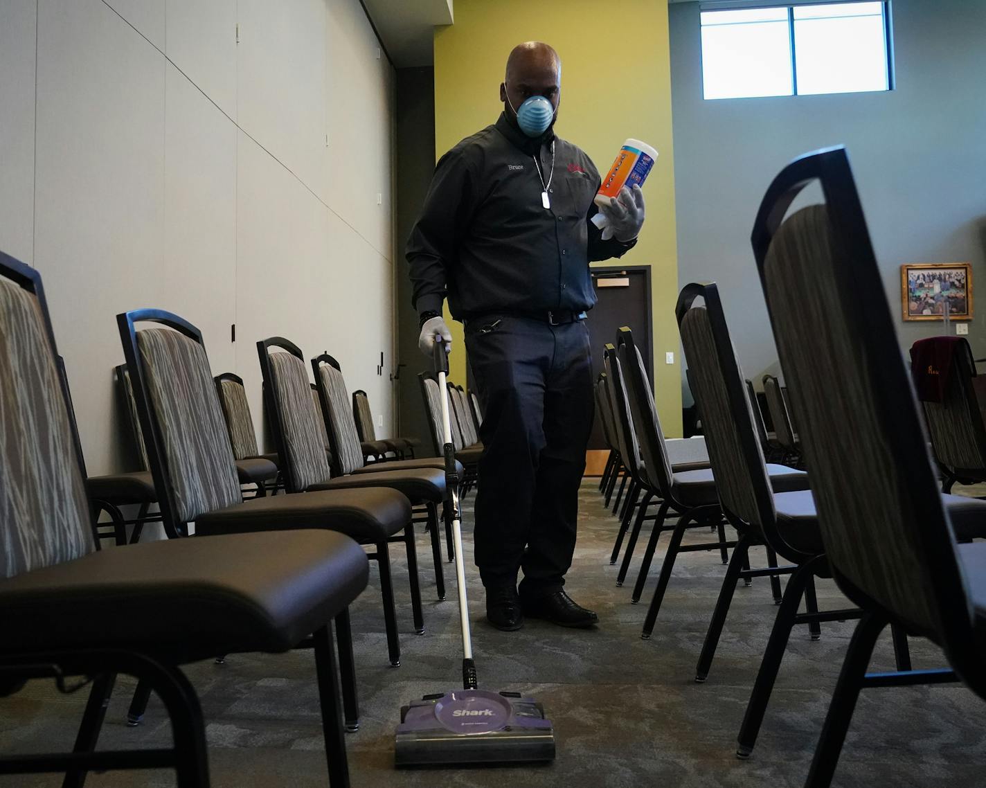 Estes Funeral Chapel CFO and directors assistant Bruce DeArmon, Sr. vacuumed and disinfected a chapel between memorial services. ] Shari L. Gross &#x2022; shari.gross@startribune.com Estes Funeral Home in Minneapolis is taking extra precautions during the COVID-19 breakout, including extra cleaning between memorial services. Since 2018, Estes has been wired to provide livestreaming video which they encourage people to use to stay safe away from crowds and still feel part of their loved one's ser