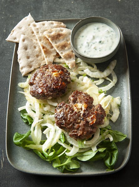 Lamb Burgers on Fennel Slaw With Mint-Garlic Sauce. Photo by Mette Nielsen * Special to the Star Tribune