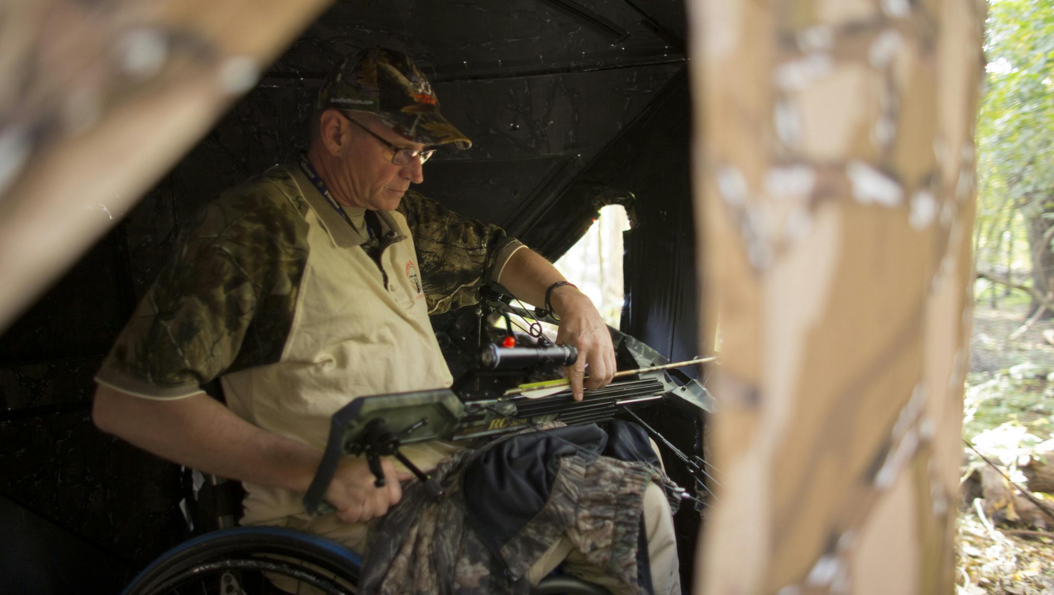 Capable Partners has been helping disabled people hunt and fish for years. Dave Guzzi and an able-bodied friend, Jayme Welsh, hunted deer Thursday evening, September 26, 2013 in a new blind area within the Minnesota Valley National Wildlife Refuge in Bloomington. Dave Guzzi notched an arrow in his crossbow as he prepared to sit for an evening of deer hunting in the portable blind that would conceal he and a friend. ] JEFF WHEELER ‚Ä¢ jeff.wheeler@startribune.com