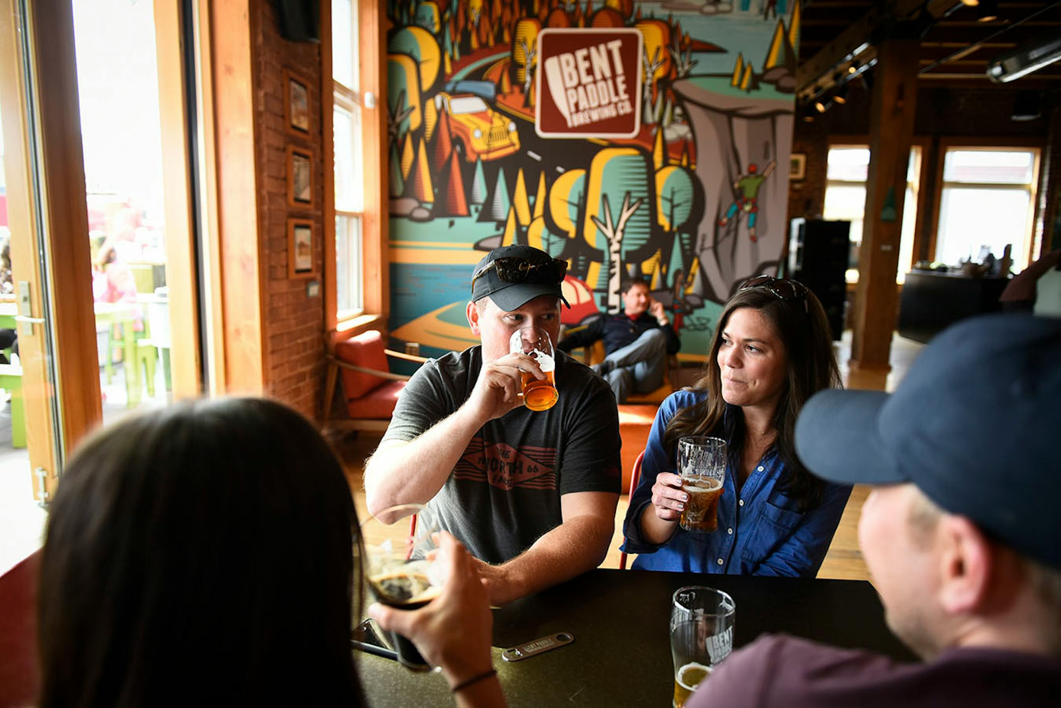 John and Jenny Cannon, of Minnetonka, took sips from their beers Thursday while hanging out with their high school friends, Taylor and Dave Truex, of Denver.