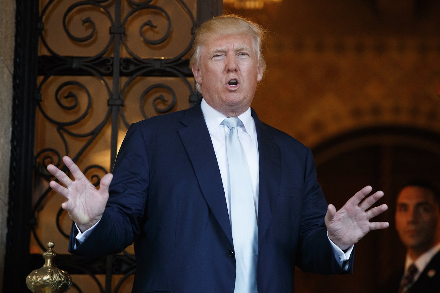 FILE - In this Wednesday, Dec. 28, 2016, file photo, President-elect Donald Trump speaks to reporters at Mar-a-Lago in Palm Beach, Fla.