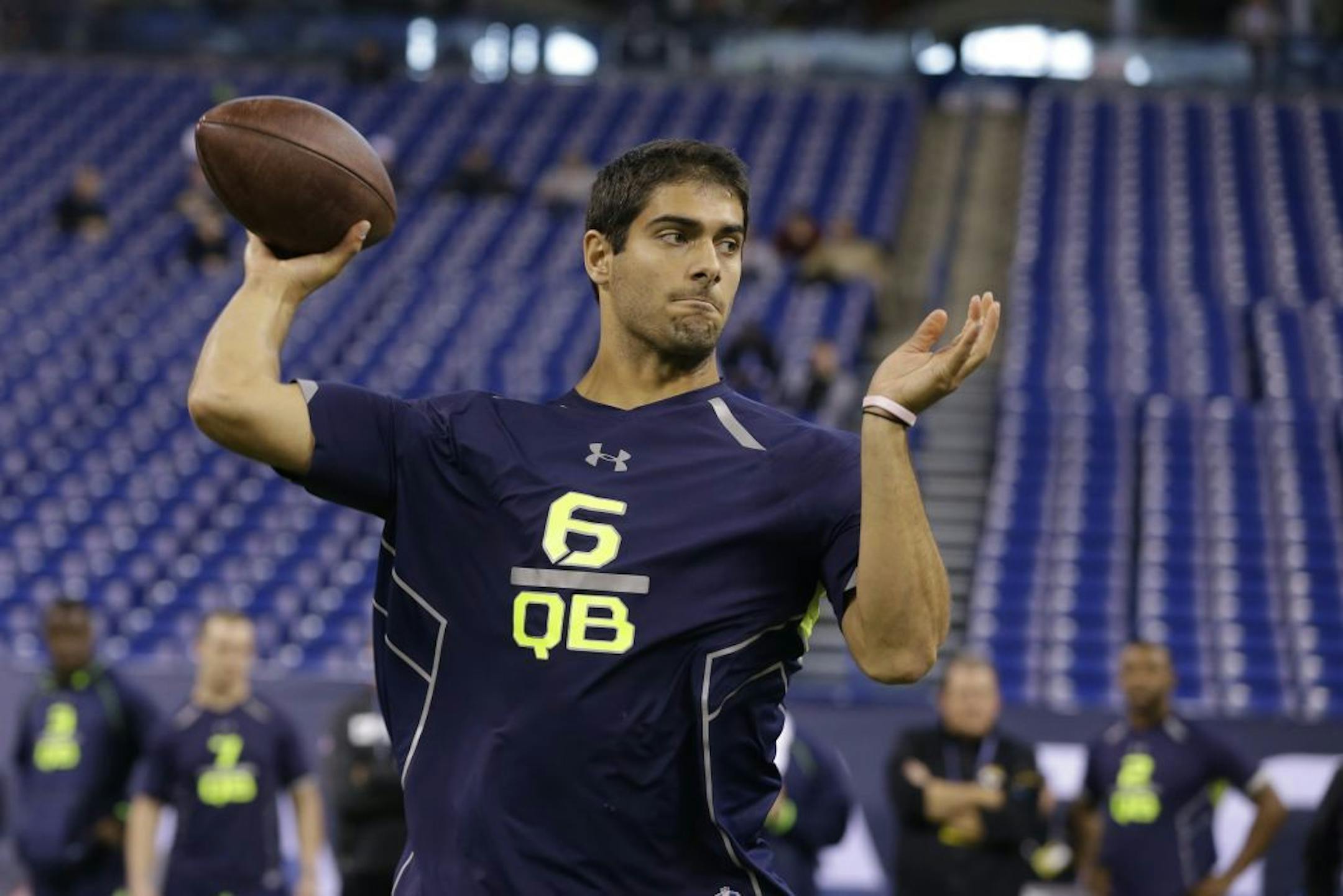 Eastern Illinois quarterback Jimmy Garoppolo throws during a drill at the NFL football scouting combine in Indianapolis, Sunday, Feb. 23, 2014.