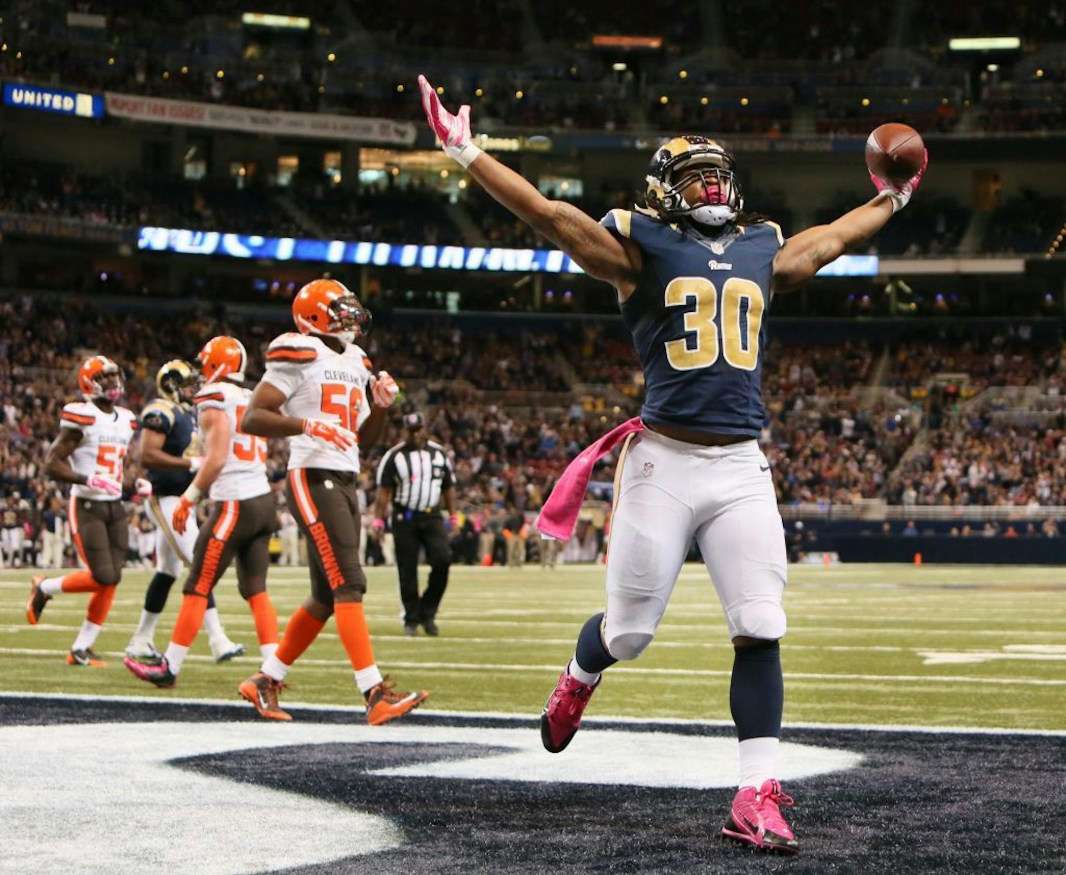 St. Louis Rams running back Todd Gurley celebrates after scoring a touchdown during the third quarter of an NFL football game against the Cleveland Browns on Sunday, Oct. 25, 2015, in St. Louis.