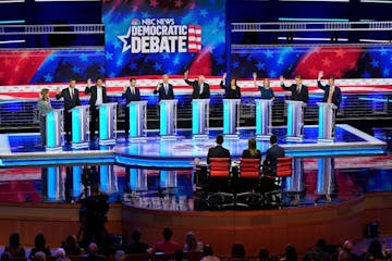 Candidates raised their hand when asked if their healthcare plan would cover undocumented immigrants during the Democratic presidential debate in Miam