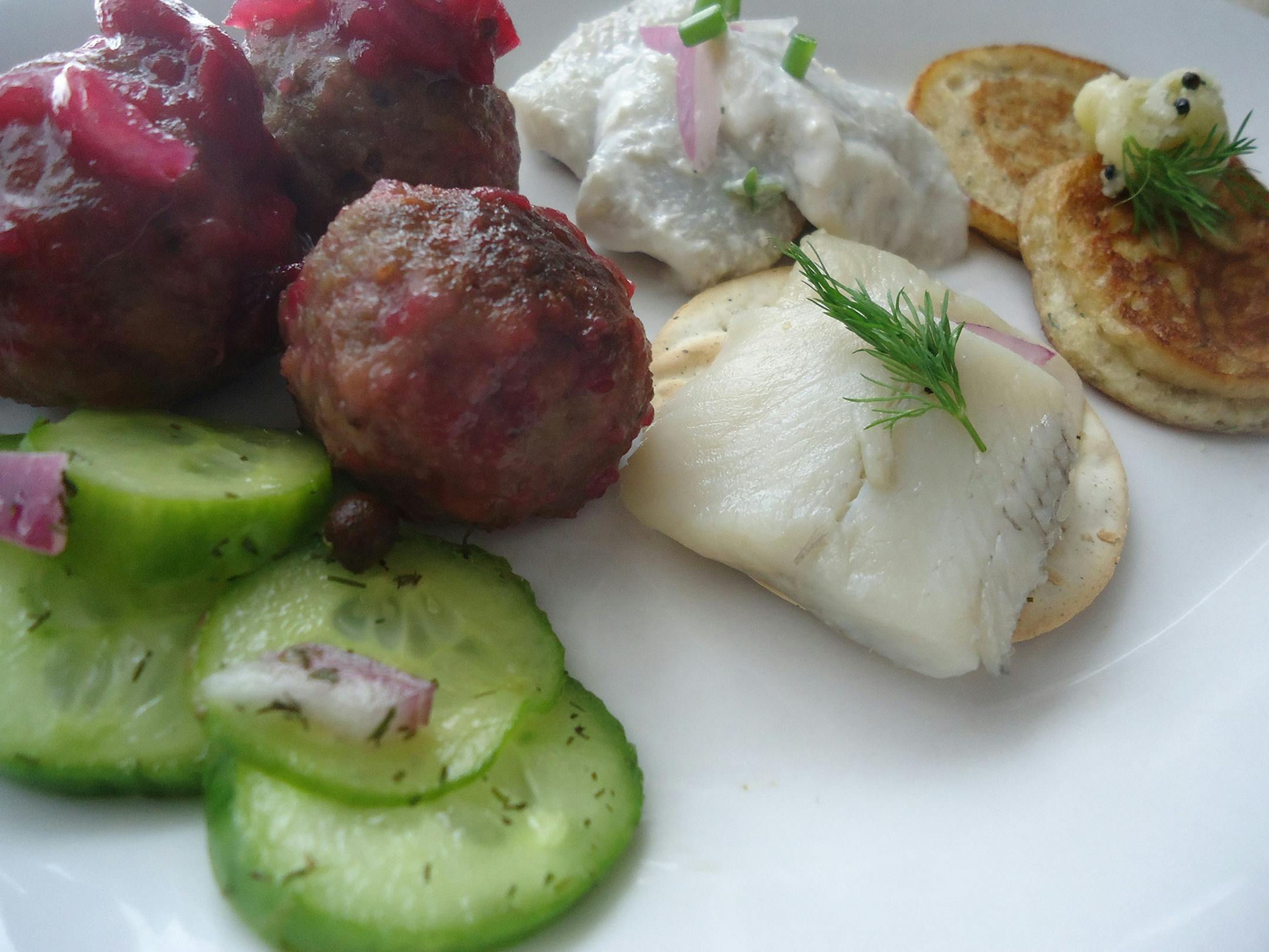 Credit: Patrice Johnson, Special to the Star Tribune Quick pickled cucumbers, modern swedish meatballs with lingonberry reduction, pickled herring, pickled herring with sour cream and horseradish, rye-dill blini with roe butter.