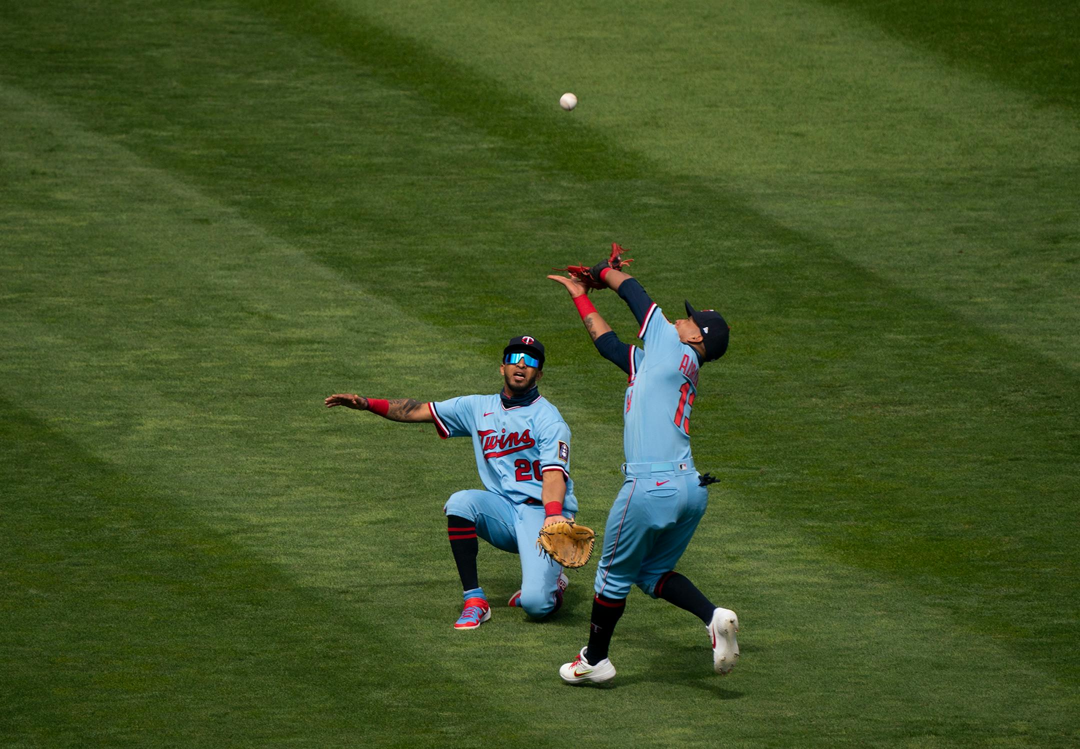 Minnesota Twins third baseman Ehire Adrianza (13) caught a pop fly by Cleveland Indians third baseman Jose Ramirez in front of left fielder Eddie Rosario (20) for the first out of the ninth inning.