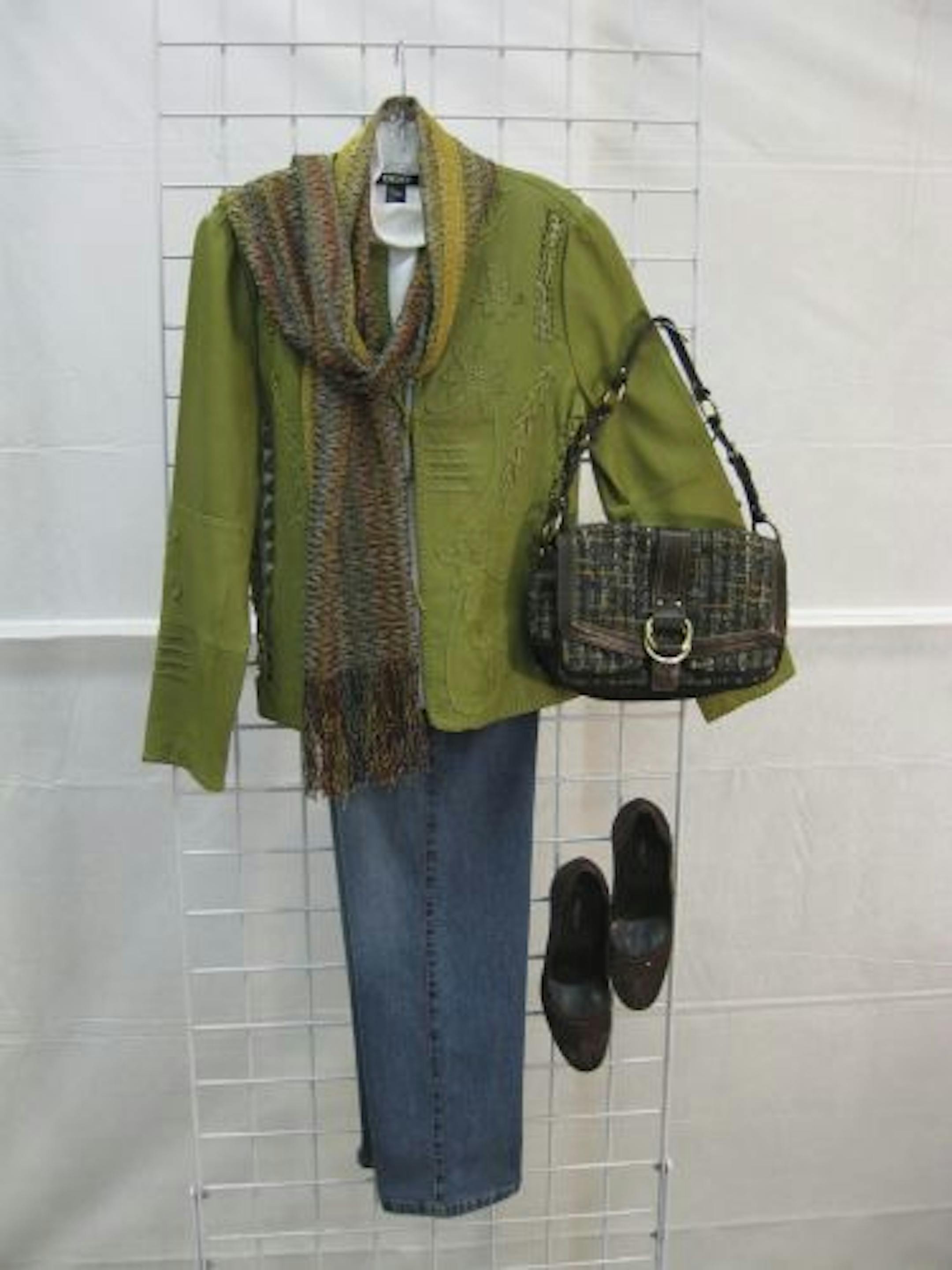 At the designer consignment clothing sale to benefit breast cancer, this Anne Klein leather jacket is $140 (reg. $695), Missoni scarf $65 (reg. $300), DKNY T-neck $12 (reg. $125), Sergio Rossi heels $120 (reg. $595), St. John jeweled jeans $90 (reg. $745) and Coach bag $75 (reg. $395).