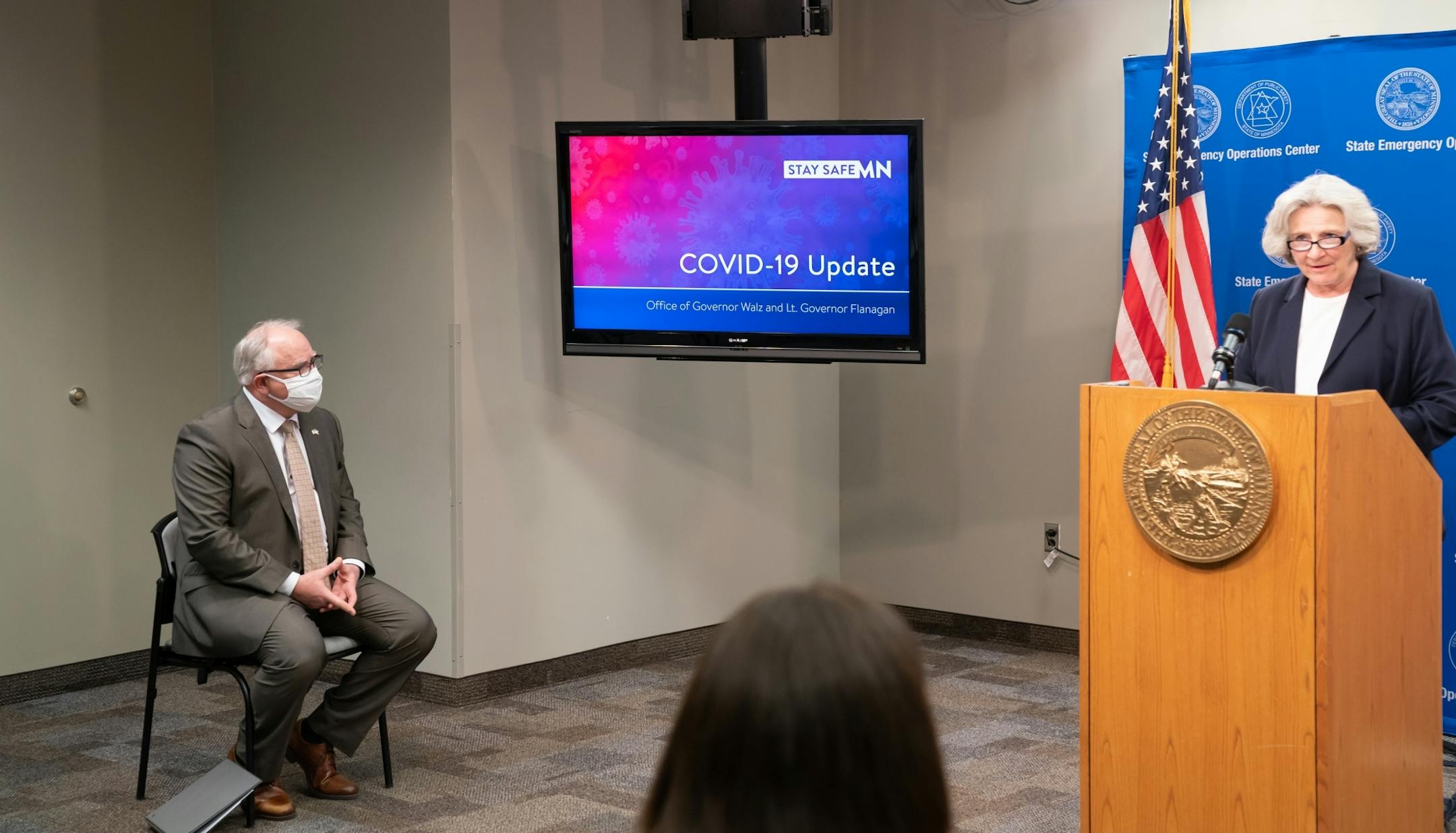 Minnesota Governor Tim Walz listened as Health Commissioner Jan Malcolm spoke. Today he announced new guidelines today for restaurants, bars, salons and barber shops.