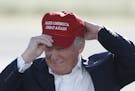 FILE - In this June 1, 2016, file photo, Republican presidential candidate Donald Trump wears his "Make America Great Again" hat at a rally in Sacrame