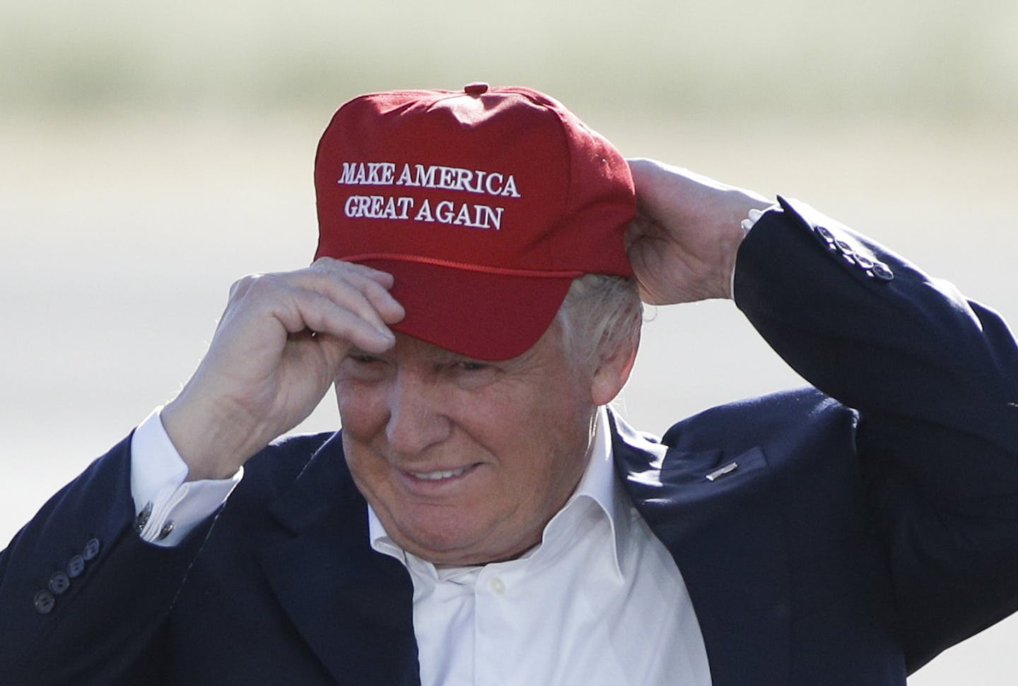 FILE - In this June 1, 2016, file photo, Republican presidential candidate Donald Trump wears his "Make America Great Again" hat at a rally in Sacramento, Calif. Trump&#xed;s &#xec;Make America Great Again&#xee; hats proudly tout they are &#xec;Made in USA.&#xee; Not necessarily always the case, an Associated Press review found. (AP Photo/Jae C. Hong, File)