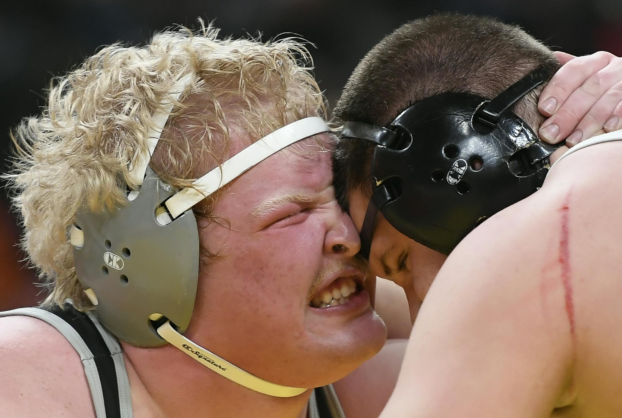 Calvin Menke, from Scott West, left, wrestled Logan Wingert, from Plainview-Elgin-Millville, during a Class 2A, 285lb quarterfinal bout Friday. Wingert won by decision 4-1. ] Aaron Lavinsky ¥ aaron.lavinsky@startribune.com The Class 3A, 2A and 1A wrestling state meet quarterfinals were held Friday, March 1, 2019 at the Xcel Energy Center in St. Paul. Minn.