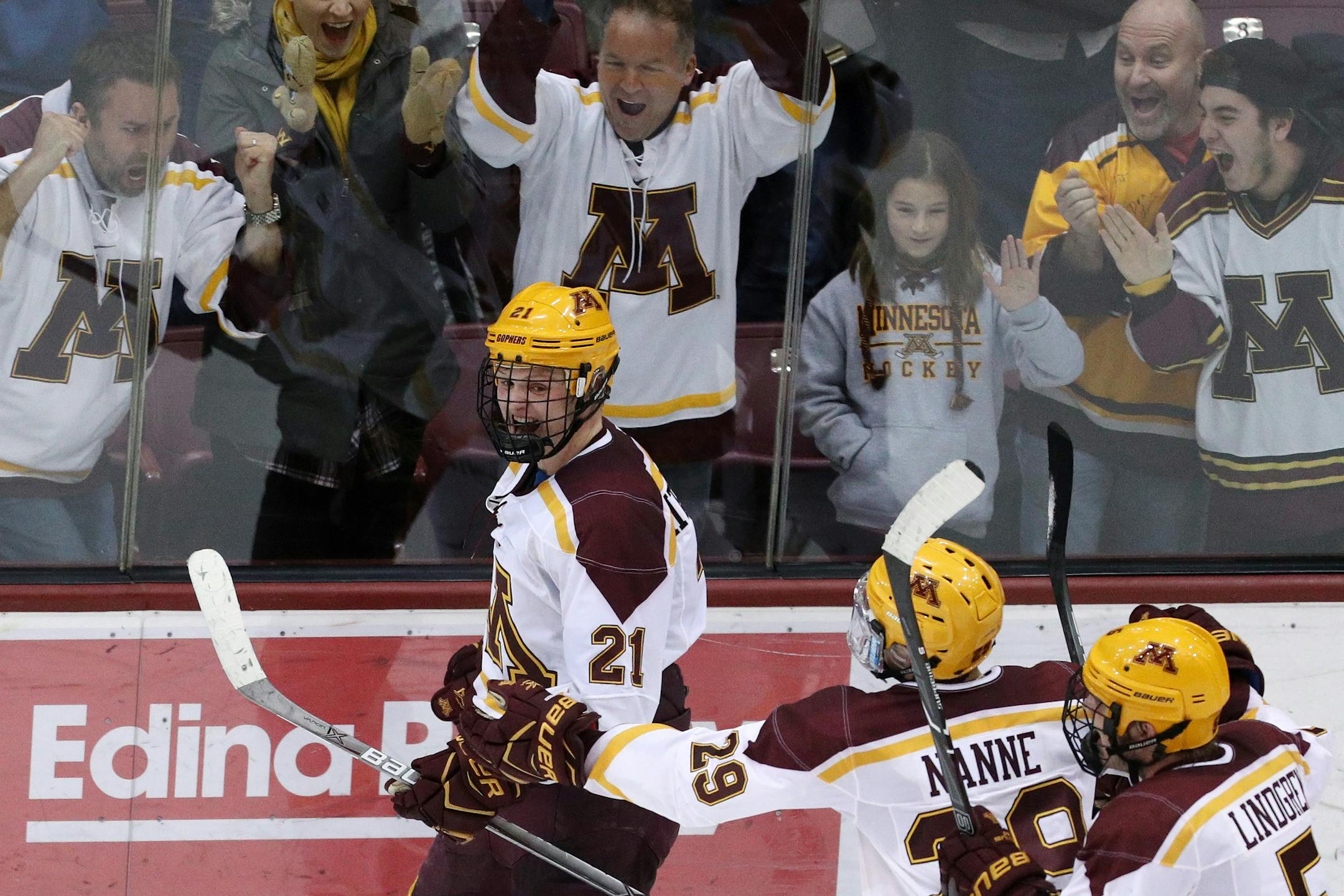Gophers forward Casey Mittelstadt celebrated with his teammates after scoring the game-winning goal vs. Notre Dame