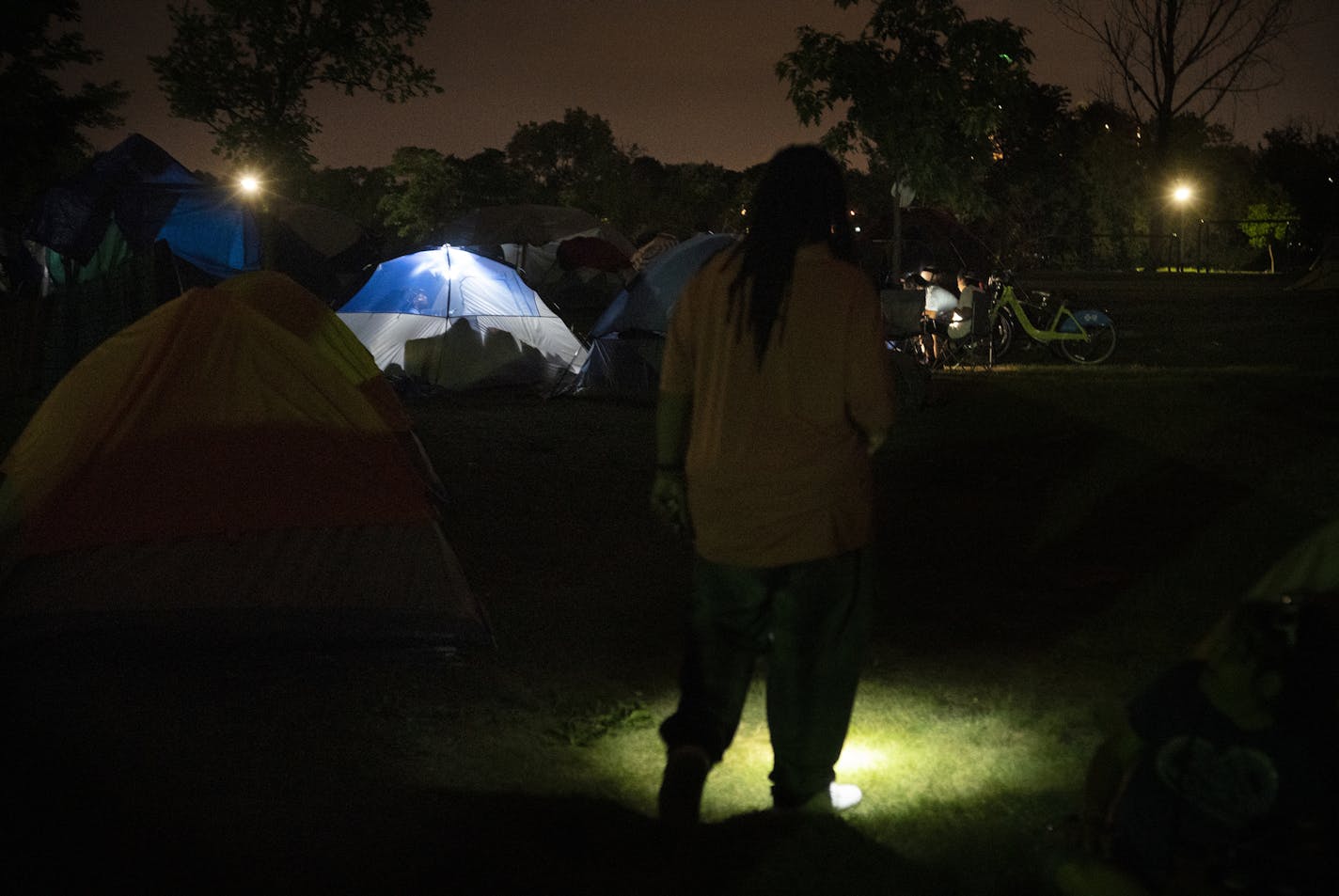 Minneapolis Park Board Commissioner Londel French does a patrol around the encampments at Powder Horn Park to make sure things are peaceful.] Developing narrative of how the homeless encampment at Powderhorn Park is functioning amid growing controversy about safety in the neighborhood. RICHARD TSONG-TAATARII ¥ richard.tsong-taatarii@startribune.com