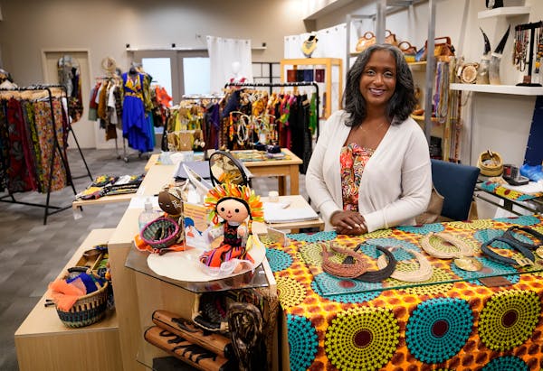 Satiya Amporful, owner of Uniquely Global, stands inside her internationally sourced store in downtown Minneapolis.