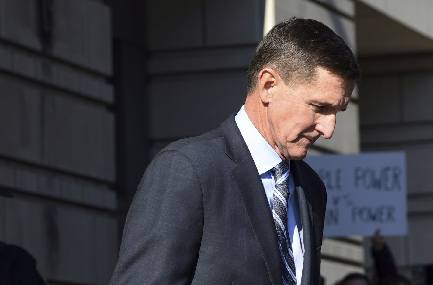 Former Trump national security adviser Michael Flynn leaves federal court in Washington, Friday, Dec. 1, 2017. Flynn pleaded guilty Friday to making false statements to the FBI, the first Trump White House official to make a guilty plea so far in a wide-ranging investigation led by special counsel Robert Mueller. (AP Photo/Susan Walsh)