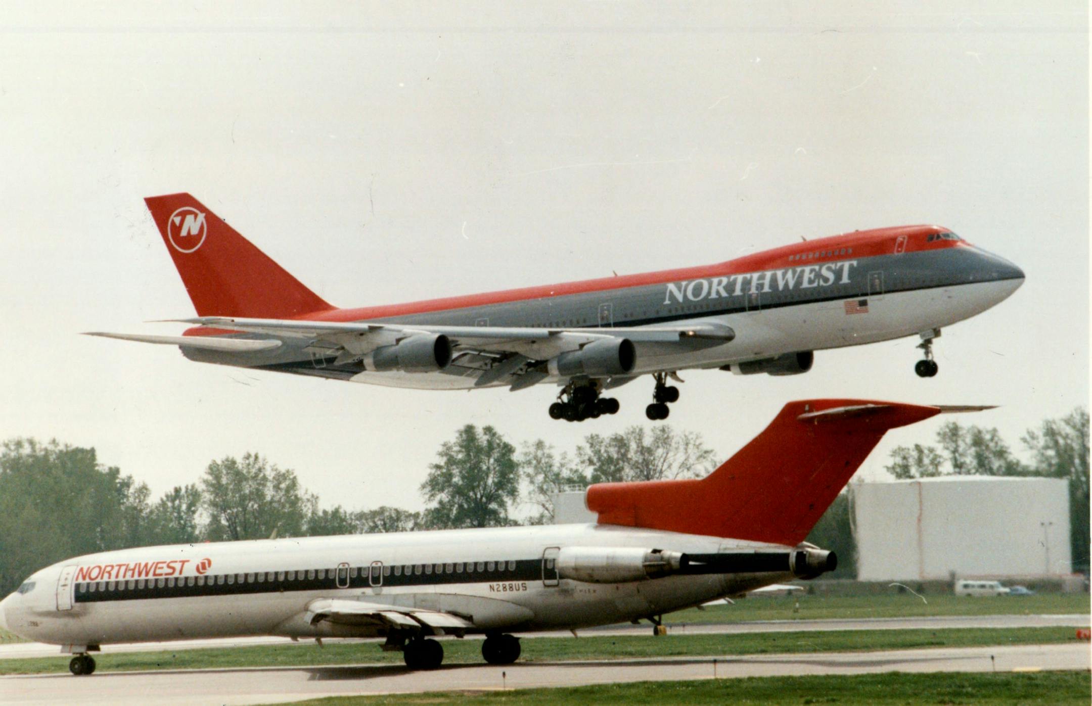 A photo taken in May 1989 shows a 747 with Northwest's then-new paint scheme landing at Minneapolis-St. Paul International airport as a plane with the companys old design was taking off. Northwest relied on the 747 for its international flights for decades.