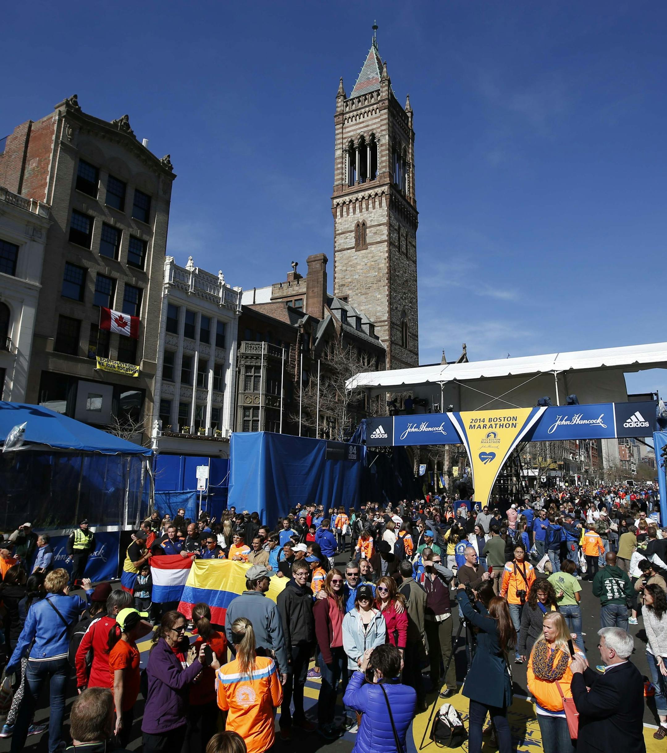 Runners and race fans crowd Boyslton Street at the Boston Marathon finish line, one day before the race, Sunday, April 20, 2014, in Boston. (AP Photo/Robert F. Bukaty)