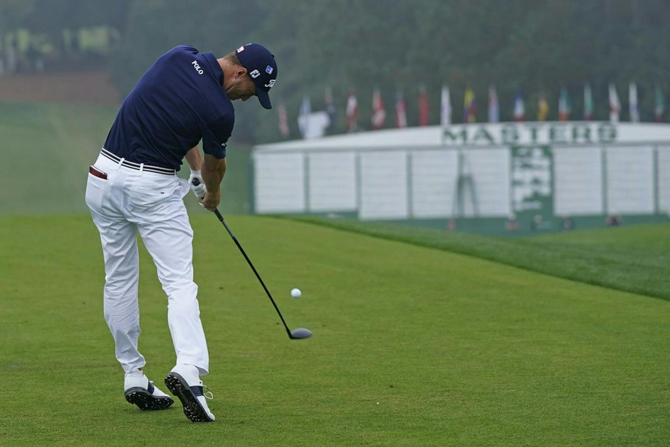 Justin Thomas tees off on the first hole during the final round of the Masters golf tournament Sunday, Nov. 15, 2020, in Augusta, Ga.