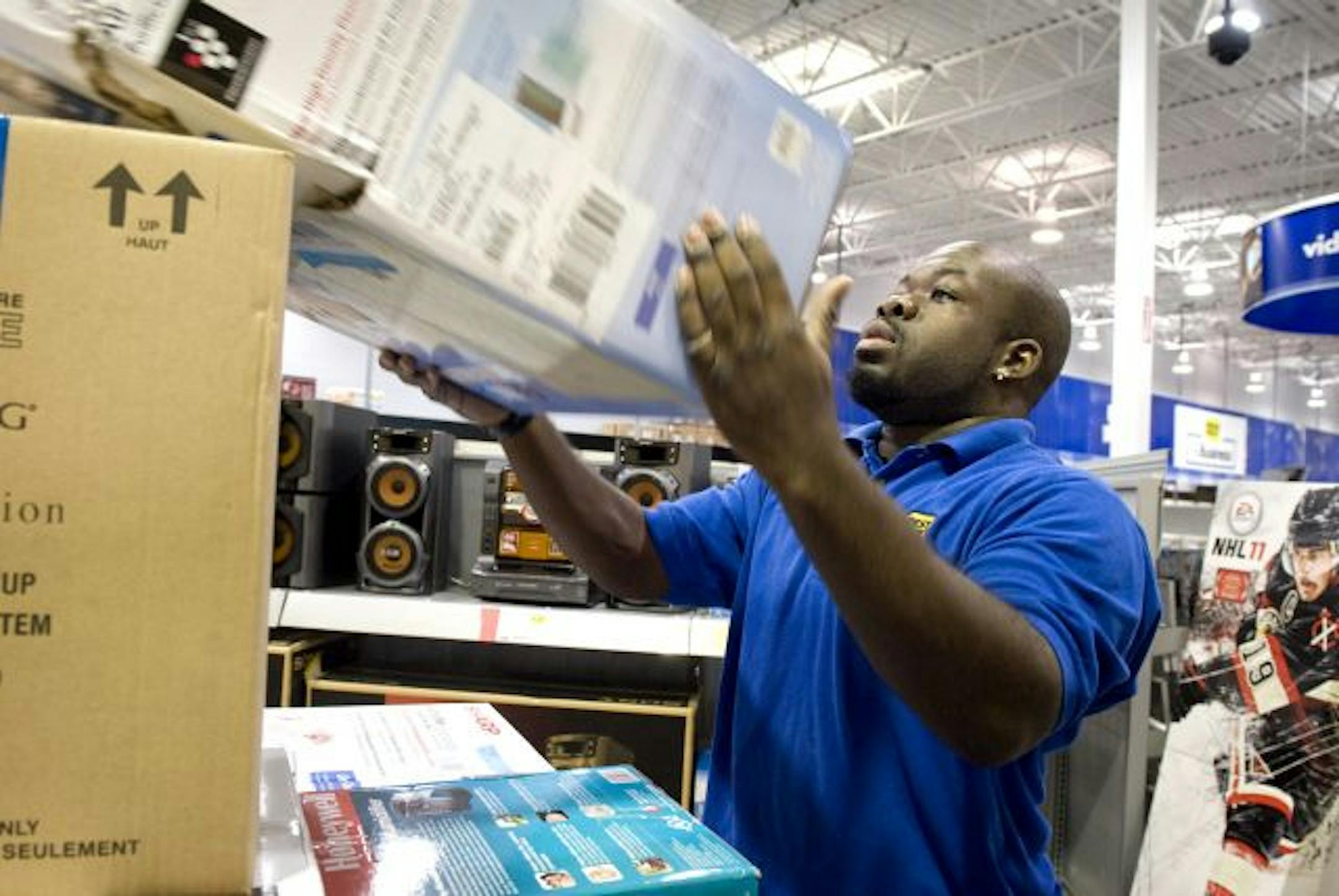 Cornell Golden stocked new appliances on shelves at the Eagan Best Buy. Best Buy had a very good earnings report this quarter.
