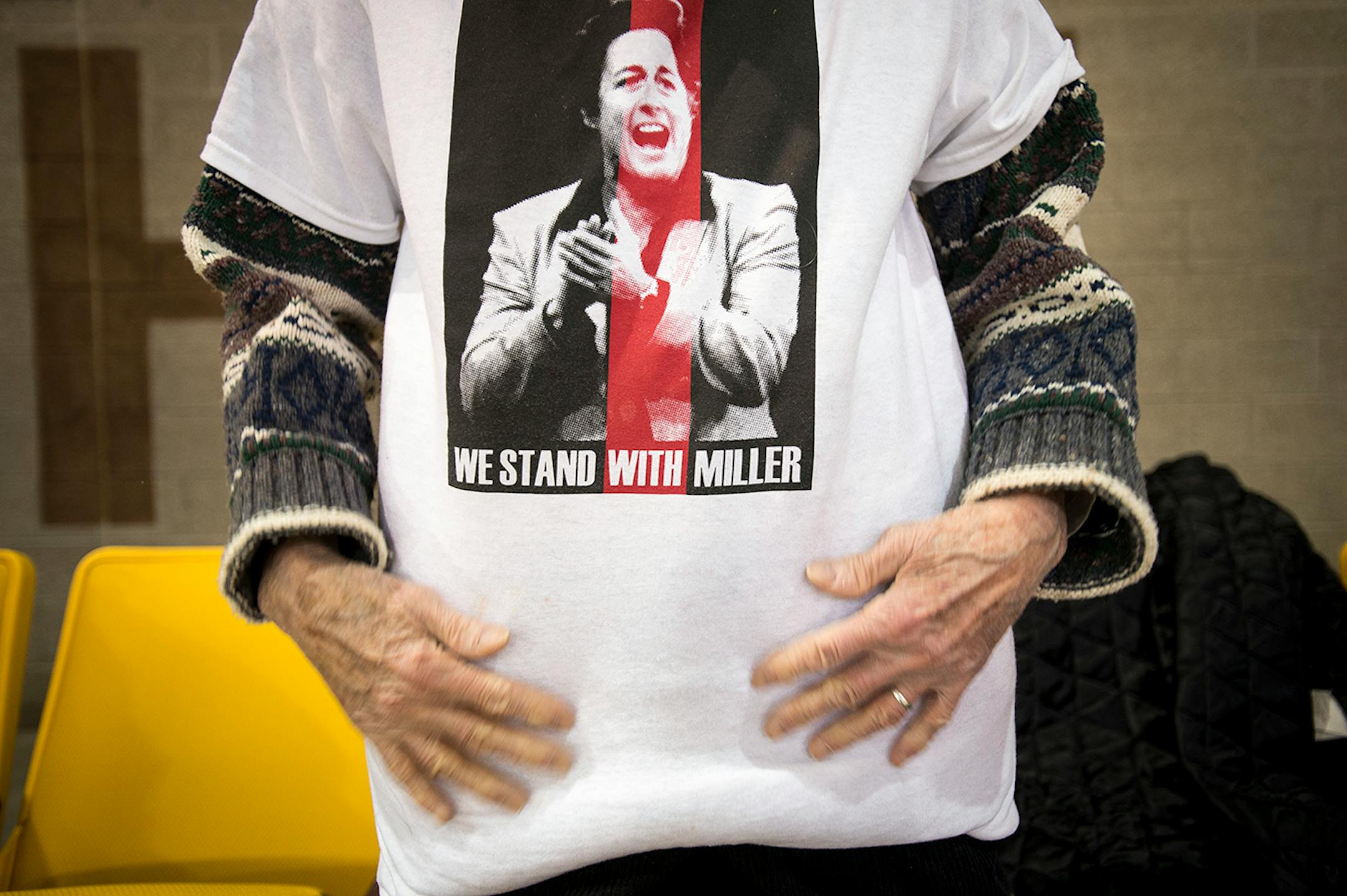 Roberta Moog, of Duluth, wears a "We Stand With Miller" shirt while attending Saturday night's UMD game against the University of North Dakota. ] (Aaron Lavinsky | StarTribune) University of Minnesota Duluth told women's hockey head coach Shannon Miller that this season would be the las of her successful run as the Bulldog's coach. After five national championships, an NCAA record, and 11 Frozen Four Victories, Miller, the highest-paid coach in women's hockey, was told her contract would not be