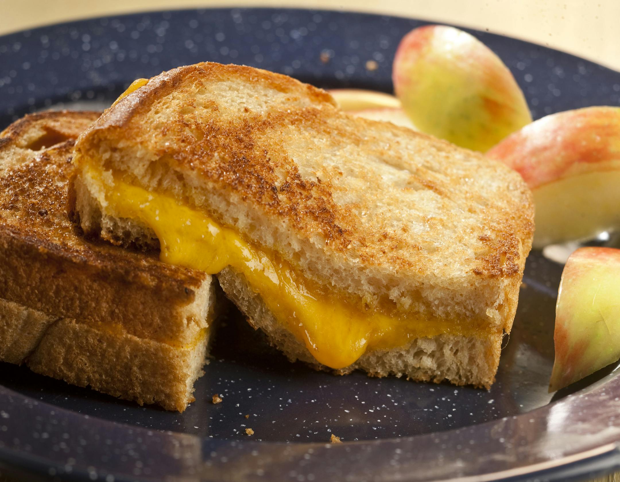 By making a few changes, such as brushing on melted butter and using natural cheddar rather than processed cheese slices, you can create a healthier grilled cheese for kids. (Bill Hogan/Chicago Tribune/MCT)