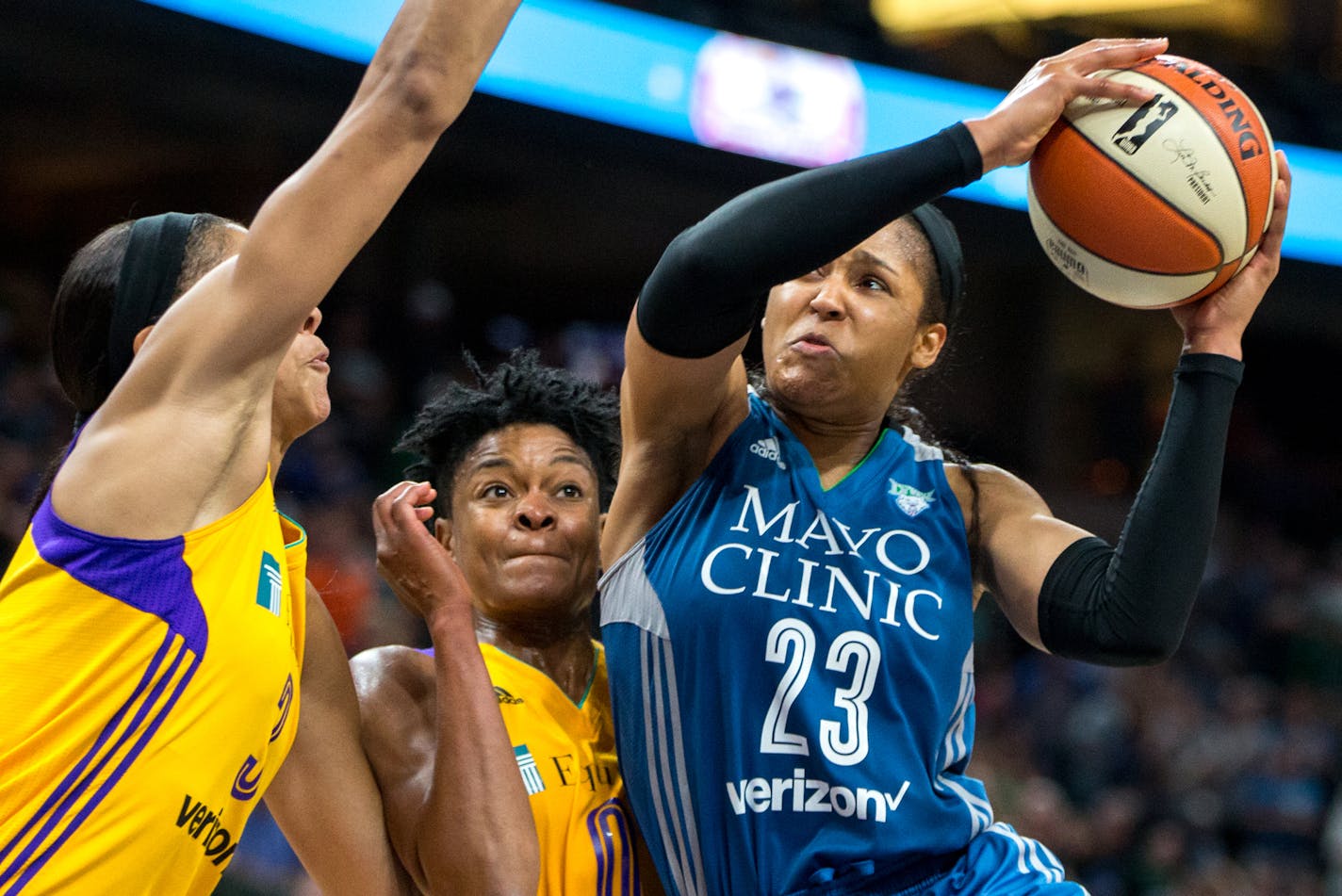 Minnesota Lynx forward Maya Moore (23) takes the ball past the Los Angeles Sparks' Alana Beard during the second half on Friday, Aug. 11, 2017, at Xcel Energy in St. Paul, Minn. The Sparks won, 70-64. (Courtney Pedroza/Minneapolis Star Tribune/TNS)