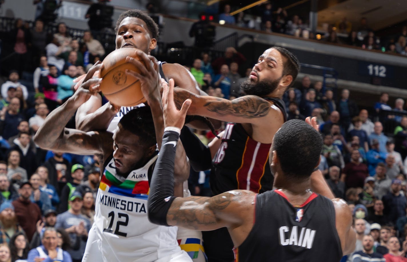 Taurean Prince (12) and Anthony Edwards (1) of the Minnesota Timberwolves grab a rebound in the fourth quarter Monday, November 21, 2022, at Target Center in Minneapolis, Minn. ] CARLOS GONZALEZ • carlos.gonzalez@startribune.com.