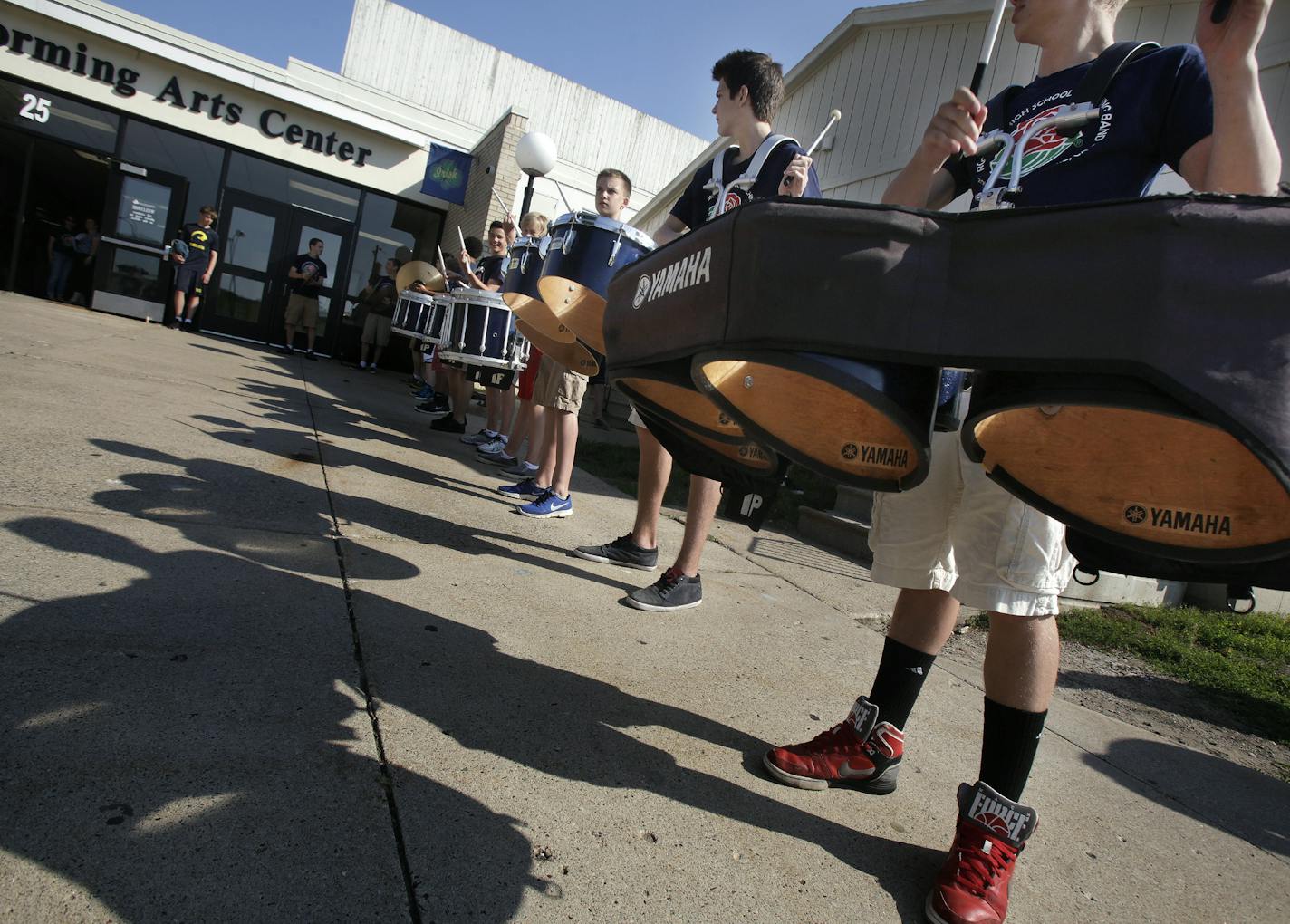 The Marching band practices for the arrival of the President of the Tournament of Roses' Scott Jenkins and his wife Cindy Jenkins at Rosemount High School on July 12, 2013. ] JOELKOYAMA&#x201a;&#xc4;&#xa2;joel koyama@startribune.com The Rosemount High School marching band was invited to be one of 12 bands to perform in the Rose Parade this year on Jan. 1 in Pasadena, Calif. The president of the Tournament of Roses, Scott Jenkins, visits all of thel cities that have a band that's been selected to