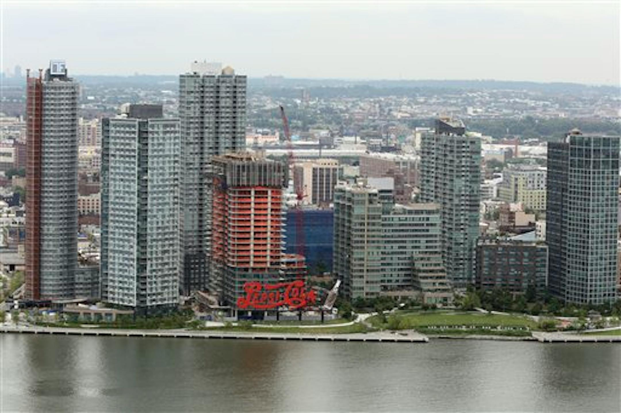 This Thursday, July 11, 2013 photo shows the Pepsi Sign in Long Island City in New York. (AP Photo/Mary Altaffer)
