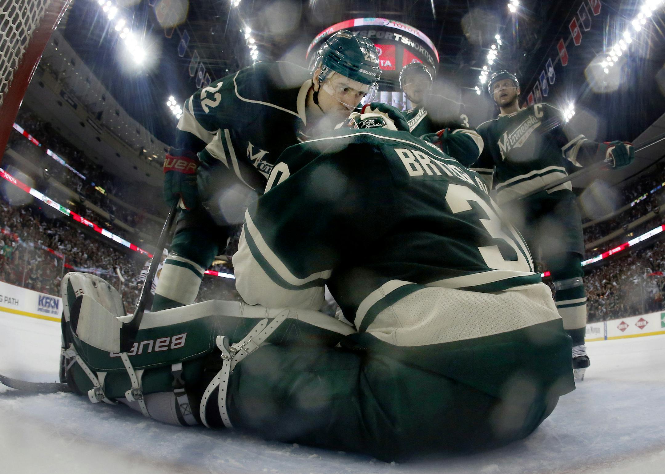 Nino Niederreiter (22) congratulated Wild goalie Ilya Bryzgalov (30) after he made a save on a shot by Jeremy Morin (11) in the third period. ] CARLOS GONZALEZ cgonzalez@startribune.com - May 9, 2014, St. Paul, Minn., Xcel Energy Center, NHL, Minnesota Wild vs. Chicago Blackhawks, Stanley Cup Playoffs Round 2, Game 4