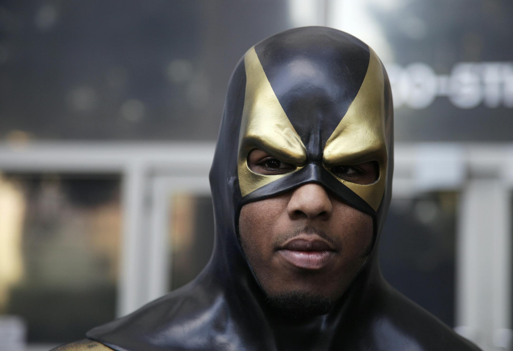 FILE - In this Oct. 13, 2011 file photo, Benjamin Fodor, a self-styled superhero who goes by the name "Phoenix Jones," wears his mask as he prepares to talk to reporters after he appeared in court in Seattle. As more people _ often, young people _ fashion themselves into superheroes, they risk finding themselves in similar situations where they wind up hurting innocent members of the public or being shot, stabbed or beaten themselves.