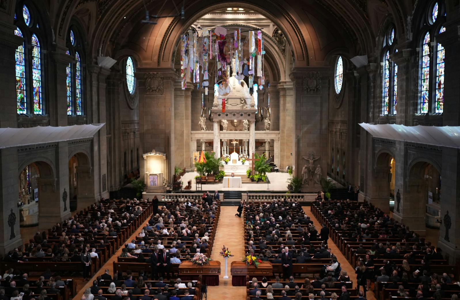 Attendees take their seats before funeral services for Mark and Melissa Hortman at the Basilica of St. Mary in Minneapolis.
