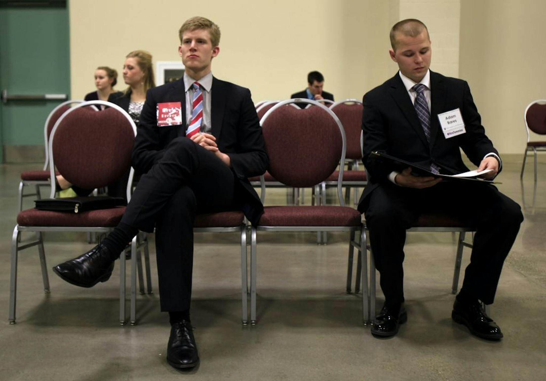 February, 2013: Drew Breyer from Minnestrista, MN, a senior at St. John's University (left) and Adam Bares (right) from South St. Paul MN, a senior at St. Thomas waited for interviews at job fair at the Minneapolis Convention Center.