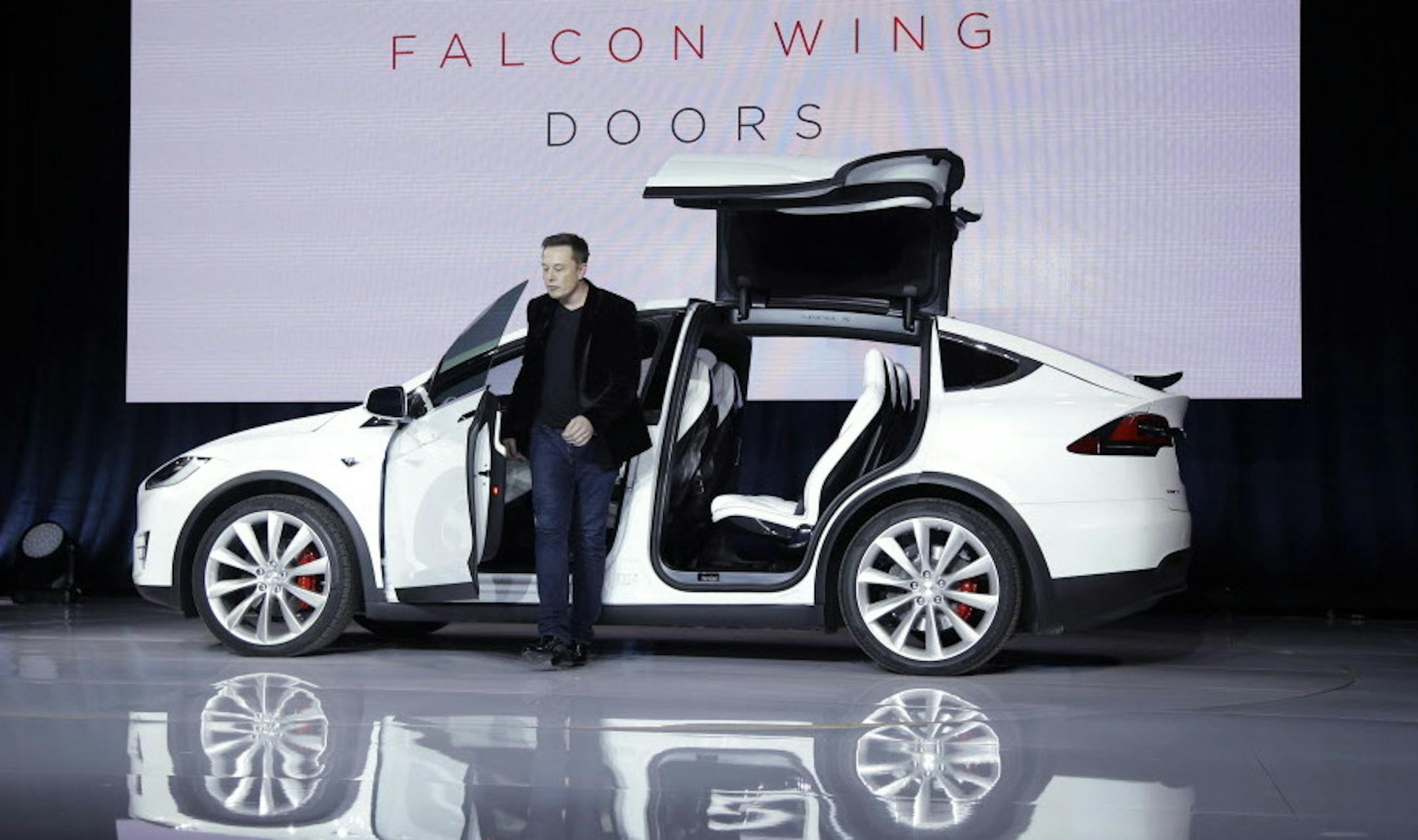 Elon Musk, CEO of Tesla Motors Inc., introduces the Model X car at the company's headquarters Tuesday, Sept. 29, 2015, in Fremont, Calif. (AP Photo/Marcio Jose Sanchez)
