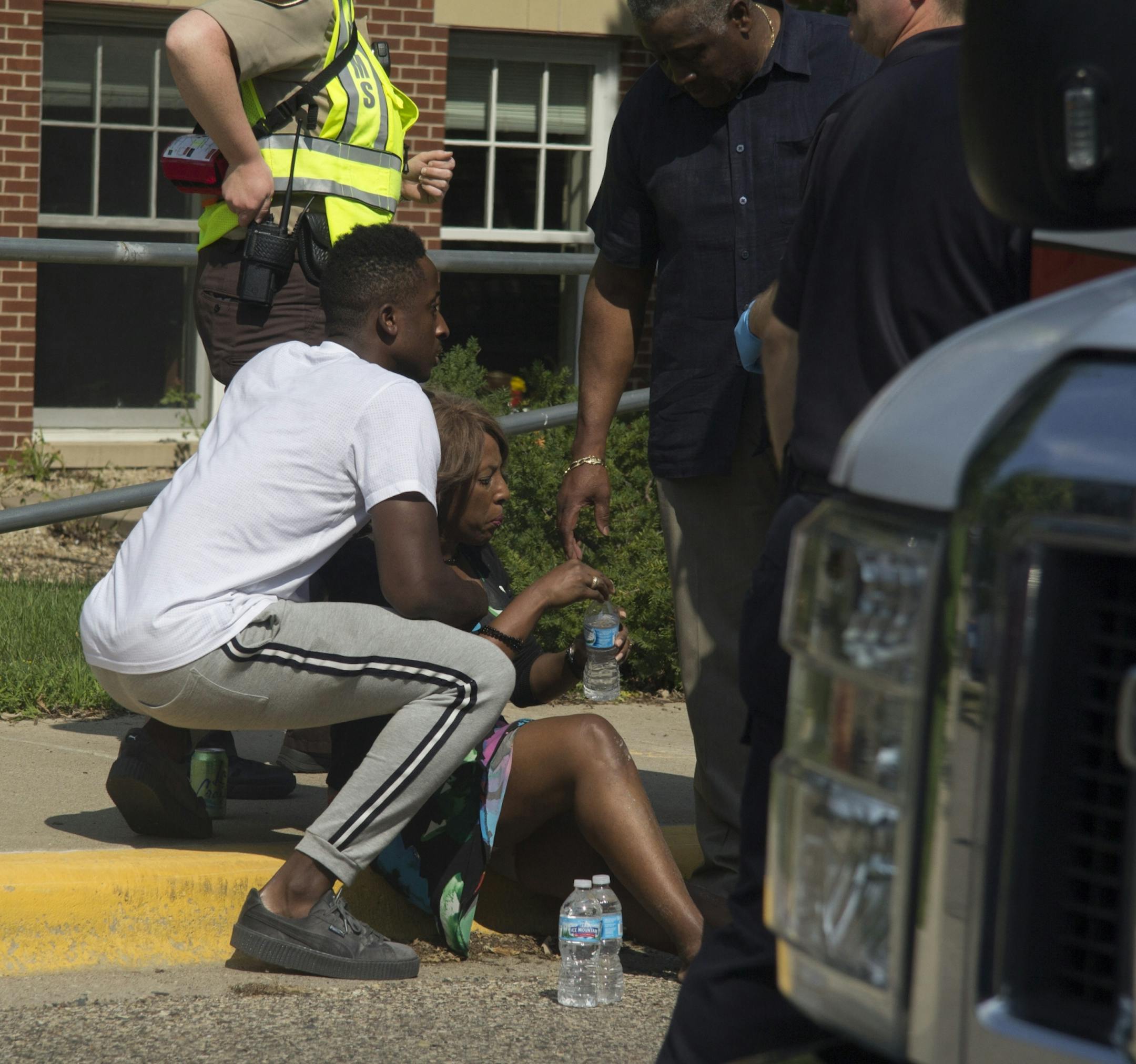 A woman injured in a gas explosion at the Minnehaha Academy is given medical attention.