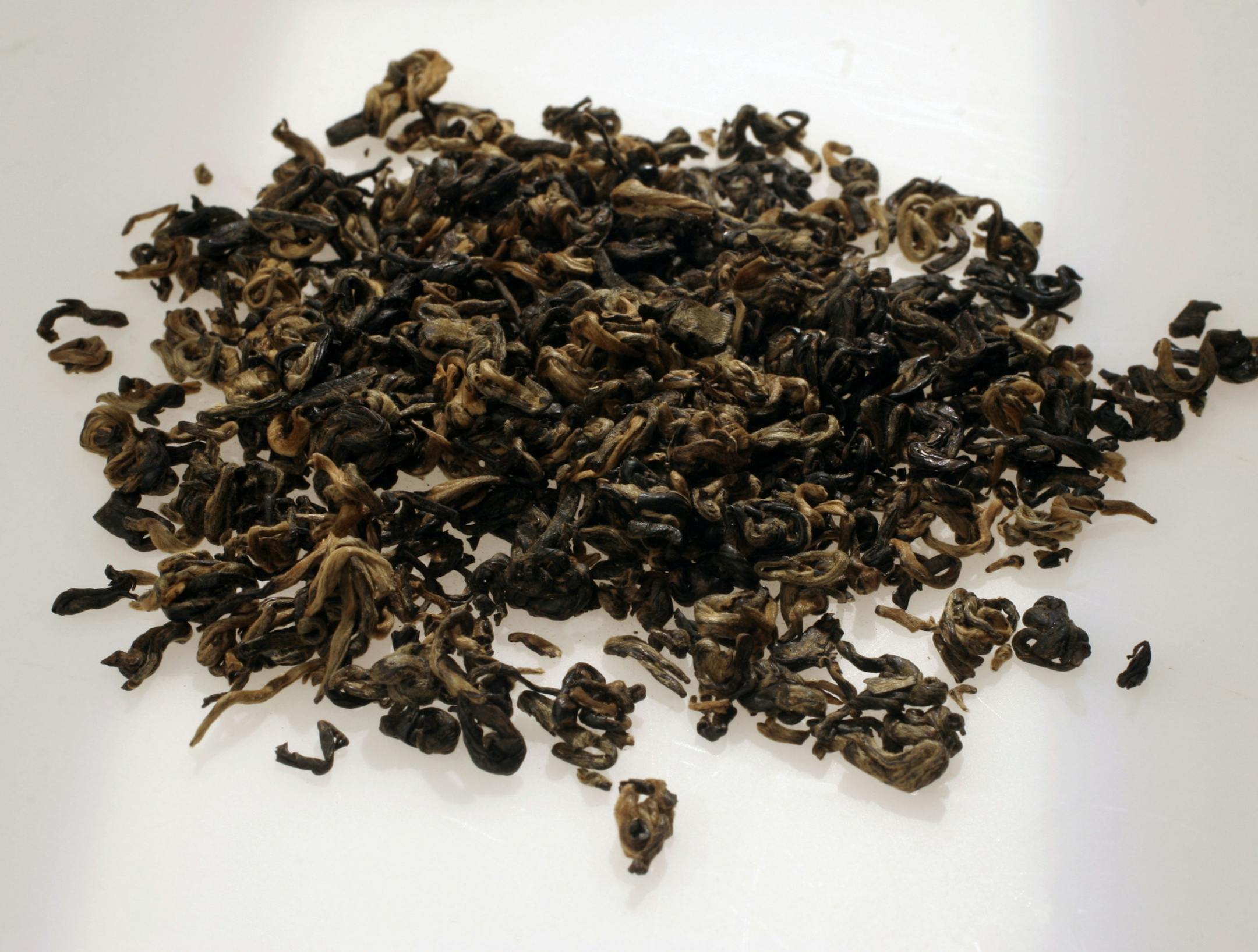 China Black Special: Within each type of tea is a range of colors, leaf shape and textures. This black tea has some brown and even white leaves.