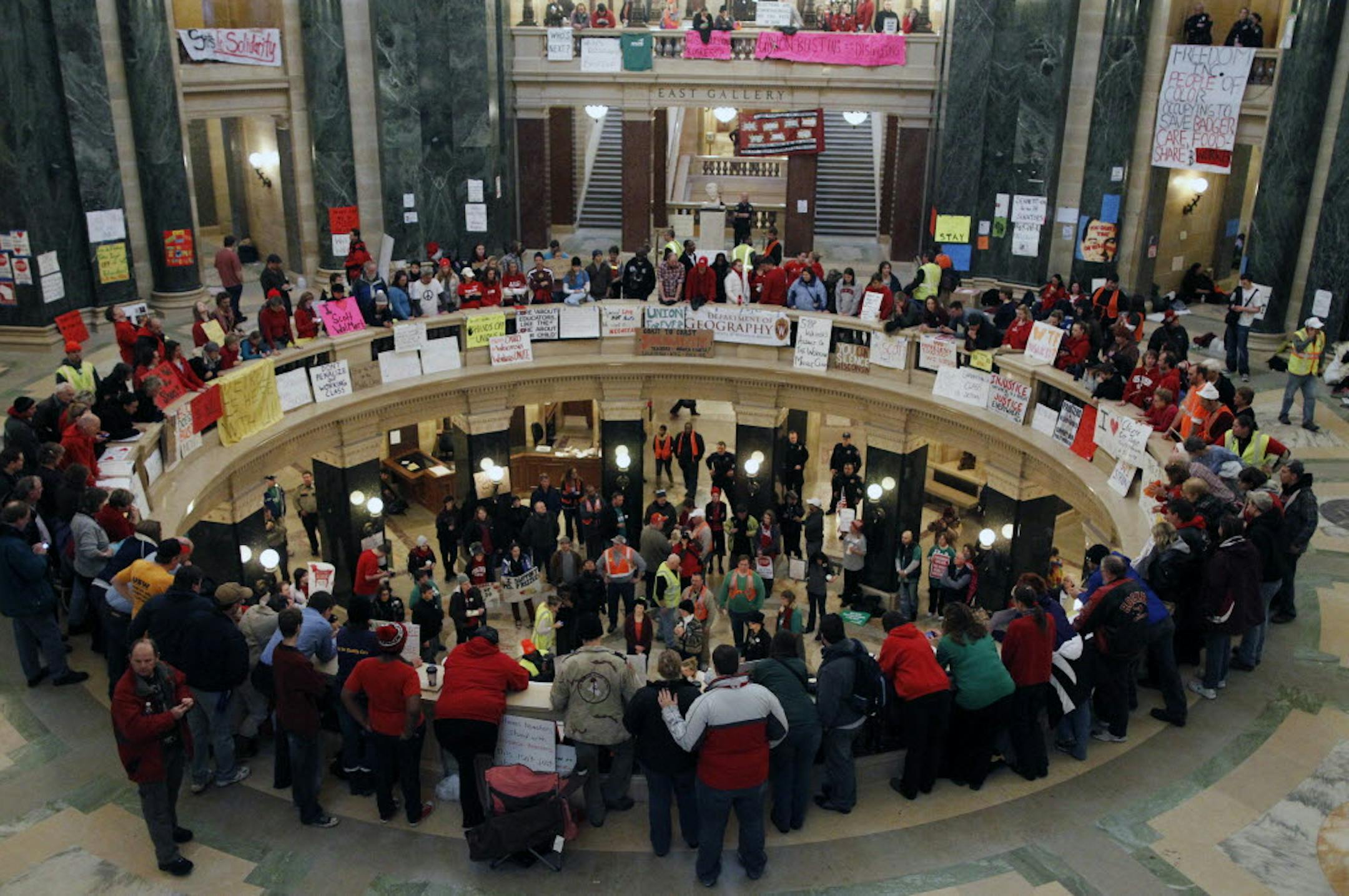 At the Wisconsin state capitol, protesters took over the rotunda protesting Gov. Scott Walker's efforts to limit the rights of state union employees to bargain collectively.