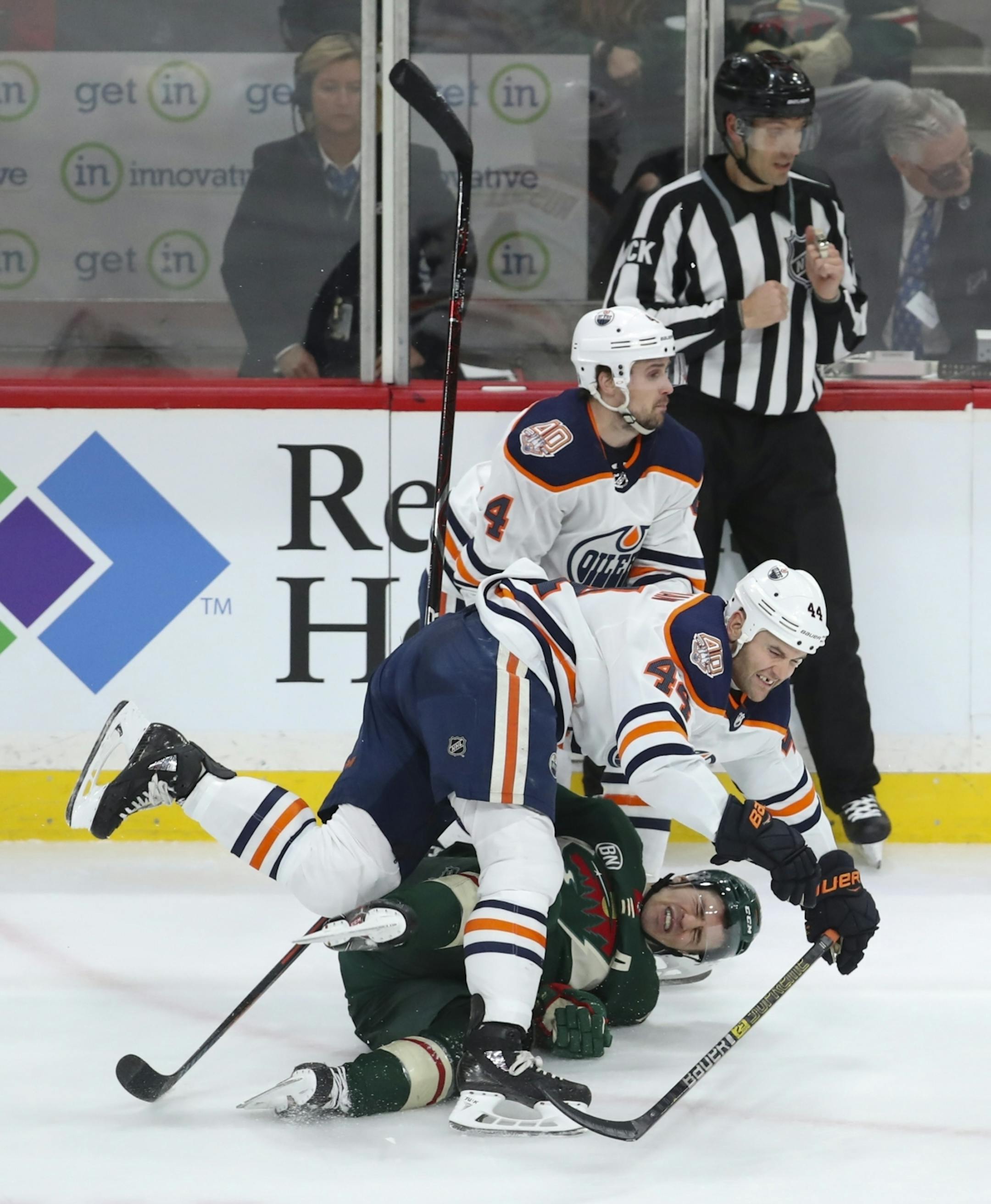 Edmonton Oilers right wing Zack Kassian (44) blindsided Minnesota Wild left wing Zach Parise (11) with a hit in the third period. There was no call on the play.
