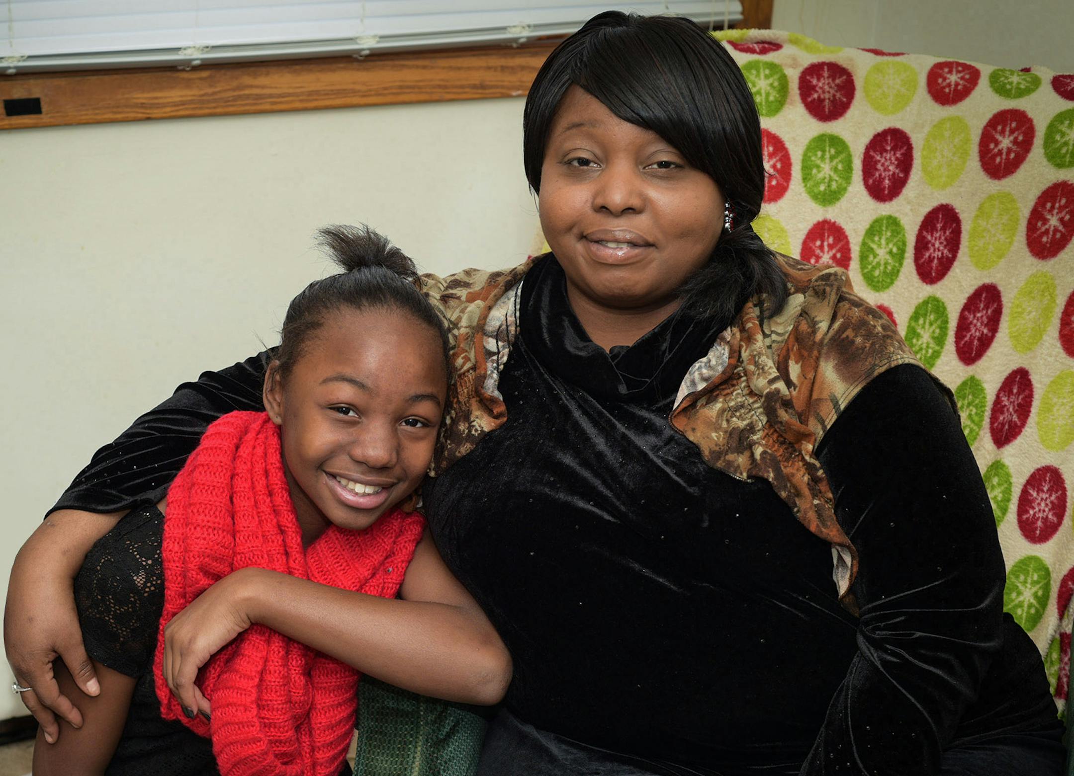 Regina Wilson, Reginaís daughterís name is LaShae, and LaShaeís influence on getting her mother to escape Chicago. The photographer is Jeff Achen.