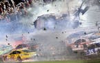 Austin Dillon (3) goes airborne and hits the catch fence as he was involved in a multi-car crash on the final lap of the NASCAR Sprint Cup series auto