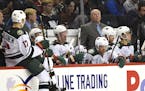 Minnesota Wild head coach Bruce Boudreau watches the action against the New York Islanders during an NHL hockey game in New York, Sunday, Oct. 23, 201