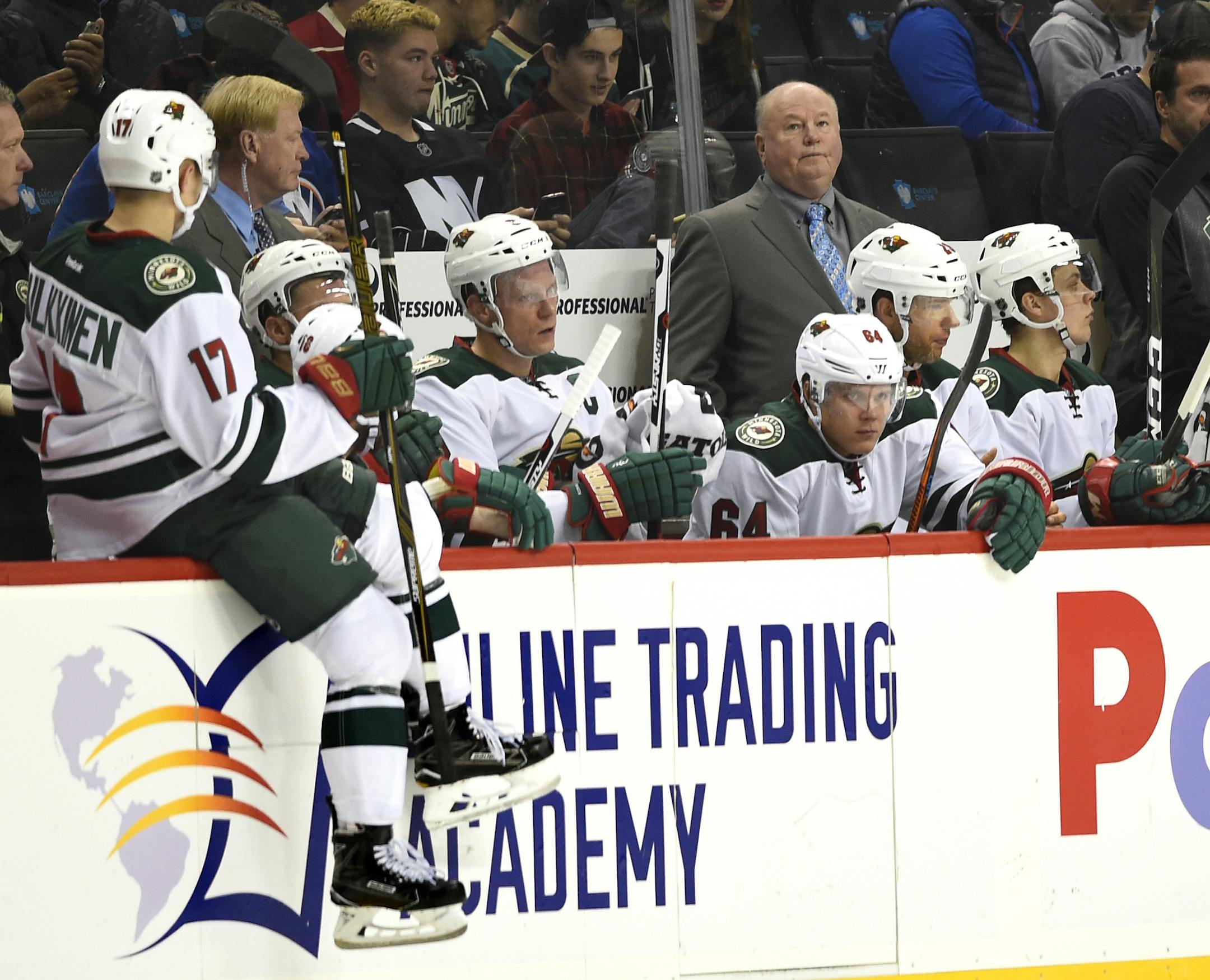 Minnesota Wild head coach Bruce Boudreau watches the action against the New York Islanders during an NHL hockey game in New York, Sunday, Oct. 23, 2016. (AP Photo/Kathy Kmonicek)